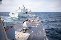 NORTH ATLANTIC OCEAN (May 11, 2023) The Arleigh Burke-class guided-missile destroyer USS Porter (DDG 78), foreground, approaches the RFA Tidesurge (A138) during a replenishment-at-sea in support of exercise Formidable Shield 2023, May 11, 2023. Formidable Shield is a biennial exercise involving a series of live-fire events against subsonic, supersonic, and ballistic targets, incorporating multiple Allied ships, aircraft, and ground forces working across battle spaces to deliver effects. (U.S. Navy photo by Mass Communication Specialist 2nd Class Sawyer Connally)