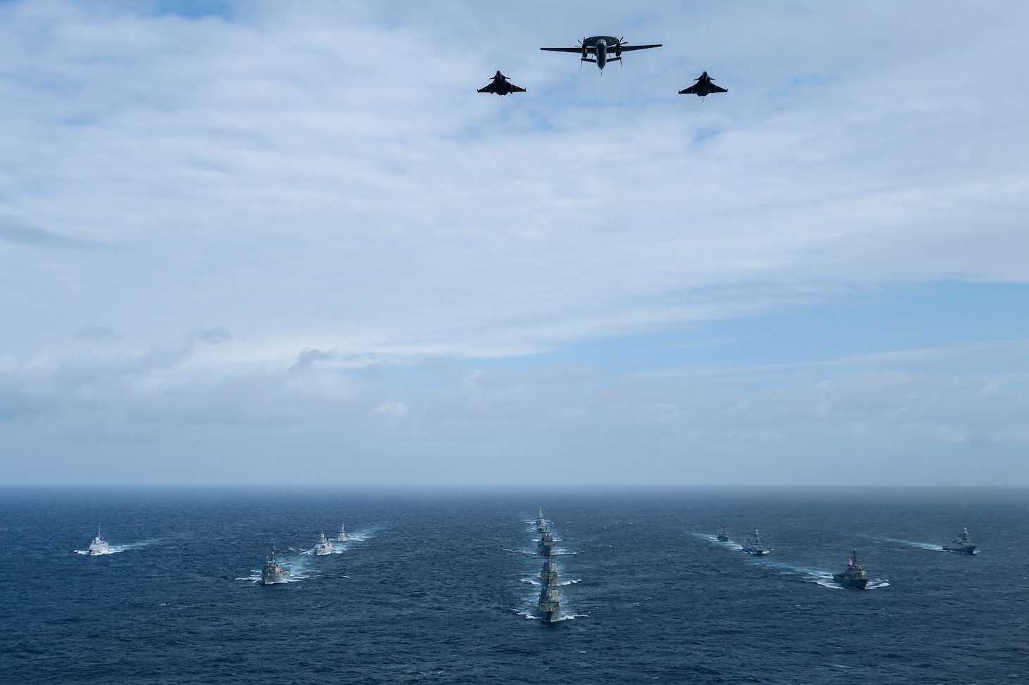 NATO Ship Formation for PHOTEX

As seen from on board HMS Defender, NATO ships form up in order to conduct a PHOTEX including a fly-over by the French Air Force during Formidable Shield 23 in the North Atlantic.

Formidable Shield is a NATO joint exercise with 2023 seeing allied fleets working together in the North Atlantic from the United States, Canada, France, Netherlands, Italy and the UK. 

HMS Defender is a type 45 destroyer air defence ship. Defender and her crew have been engaged on operations over the past 3 years, covering 4 major Oceans and most of the world's seas. Assisted by her Wildcat helicopter from 815 Naval Air Squadron, the Portsmouth based destroyer will shortly be conducting NATO's major Formidable Shield 23 exercise in the North Atlantic, where the ship ship will work with the UK's allies showcasing the Type 45 destroyer as one of the world's best air defence ships.

Photographer: SLt Henry McCarthy
