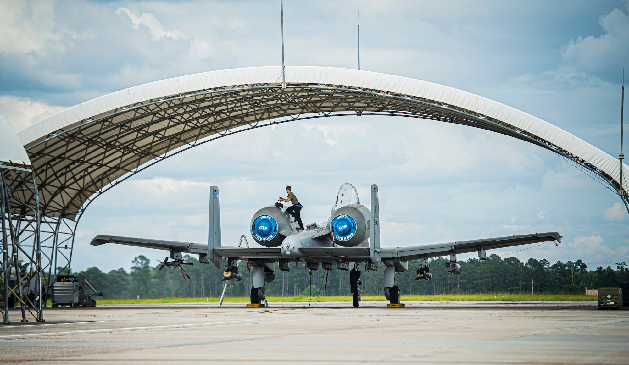 Airman works on plane