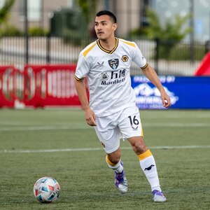 Cpl. Matthew Solis, a pharmacy technician with the 156th Information Operations Battalion, 56th Theater Information Operations Group, Washington National Guard, playing soccer with the Joint Base Lewis-McChord Football Club.