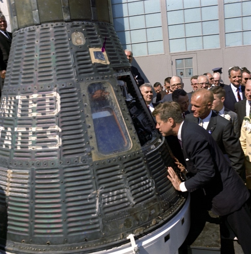 President John F. Kennedy Jr. and astronaut John H. Glenn Jr. view the Friendship 7 capsule at Cape Canaveral, Fla., Feb. 23, 1962. (National Air and Space Museum photo)