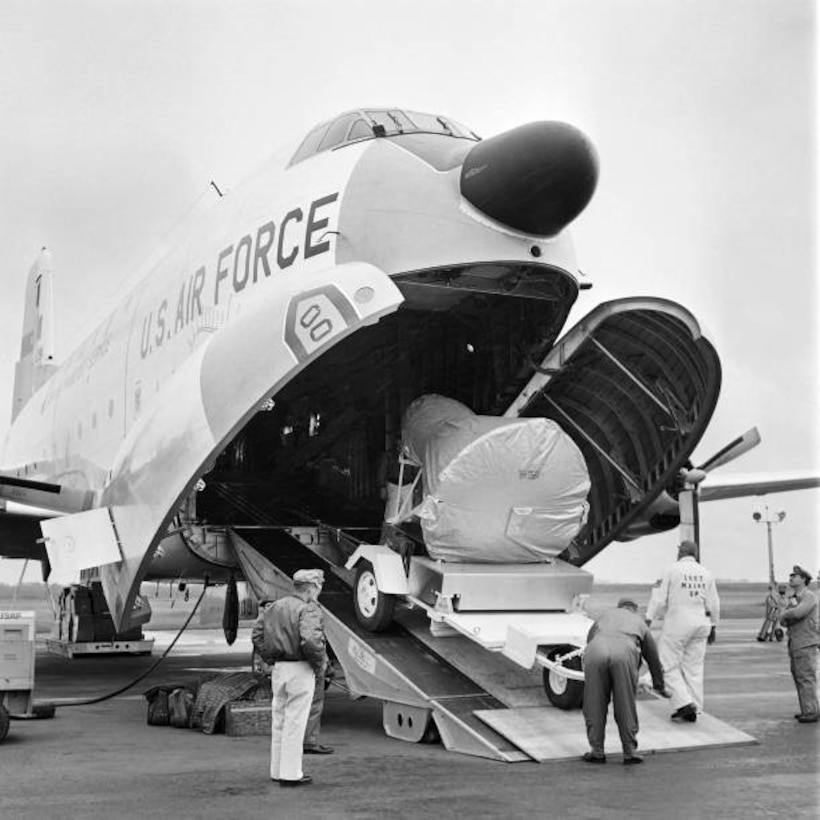 The Mercury Project 'Friendship 7' space capsule, in which U.S. astronaut John Glenn orbited the Earth three times on Feb. 20, 1962, is unloaded from a U.S. Air Force aircraft before being displayed at the Palais de la Découverte in Paris, France, on May 18, 1962. (Photo by AFP via Getty Images)