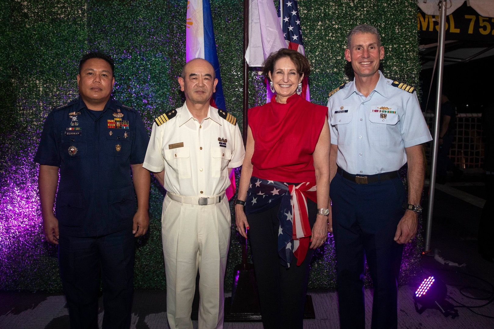 (From right) Capt. Brian Krautler, commanding officer of U.S. Coast Guard Cutter Stratton (WMSL 752), Ambassador MaryKay L. Carlson, U.S. ambassador to the Republic of the Philippines, Capt. Toru Imai, commanding officer of Japan Coast Guard Vessel Akitsushima (PLH 32), and Philippine Coast Guard Capt. Roderik Elorian, stand together arm-in-arm at a dinner aboard Stratton in Manila, Philippines, June 2, 2023, to commemorate a multi-day trilateral engagement with the three services. Stratton deployed to the Western Pacific to conduct engagements with regional allies and partner nations, reinforcing a rules-based order in the maritime domain. (U.S. Navy photo by Chief Petty Officer Brett Cote)