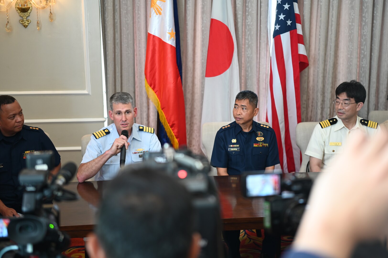 Capt. Brian Krautler, U.S. Coast Guard Cutter Stratton’s (WMSL 752) commanding officer, speaks to media during a press briefing about the scheduled at-sea joint operations planned for Stratton, the Japan Coast Guard Vessel Akitsushima (PLH 32), and the Philippine Coast Guard after departing Manila, Philippines, June 3, 2023. Stratton deployed to the Western Pacific to conduct engagements with regional allies and partner nations, reinforcing a rules-based order in the maritime domain.  (U.S. Coast Guard photo by Chief Petty Officer Matt Masaschi)