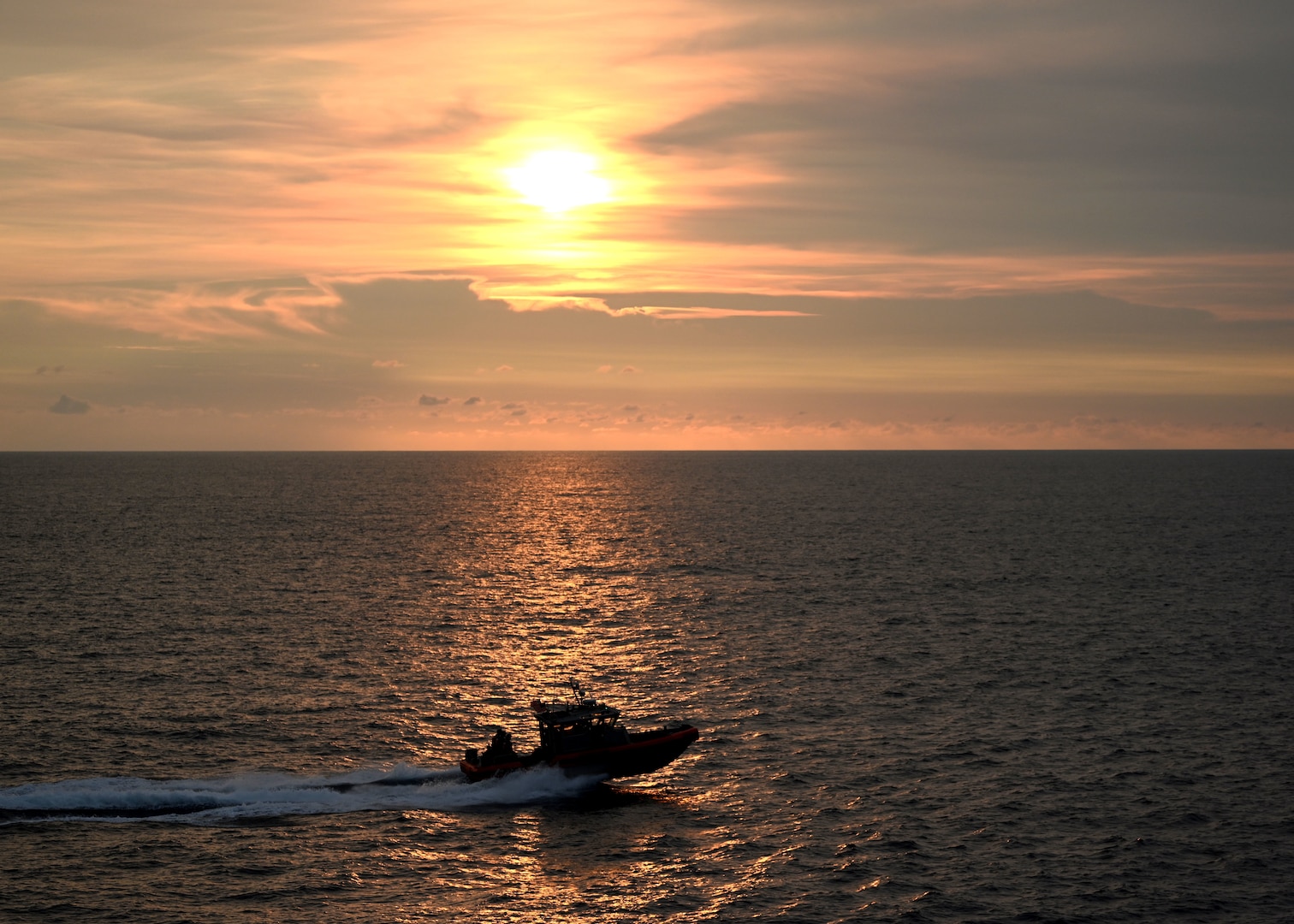 A U.S. Coast Guard Cutter Stratton (WMSL 752) boat crew aboard the cutter’s 35-foot long range interceptor transits the South China Sea while the U.S., Japan and Philippine Coast Guards conduct combined operations, June 5, 2023. Stratton’s crew are participating in the first trilateral engagements between the sea services while deployed to the Western Pacific to operate with regional allies and partner nations, reinforcing a rules-based order and maritime governance to promote a free and open Indo-Pacific. (U.S. Coast Guard photo by Chief Petty Officer Matt Masaschi)