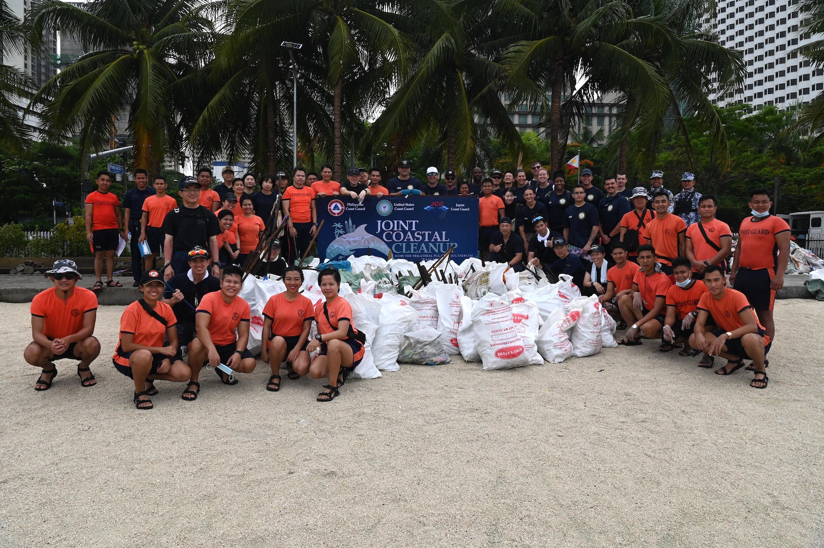 U.S. Coast Guard Cutter Stratton (WMSL 752) servicemembers pose with members from the Japan, and Philippine coast guards next to trash they collectively cleaned up during a community relations event in Manila, Philippines, June 2, 2023. Stratton deployed to the Western Pacific to engage with regional allies and partner nations, reinforcing a rules-based order and maritime governance to promote a free and open Indo-Pacific. (U.S. Coast Guard photo by Chief Petty Officer Matt Masaschi)