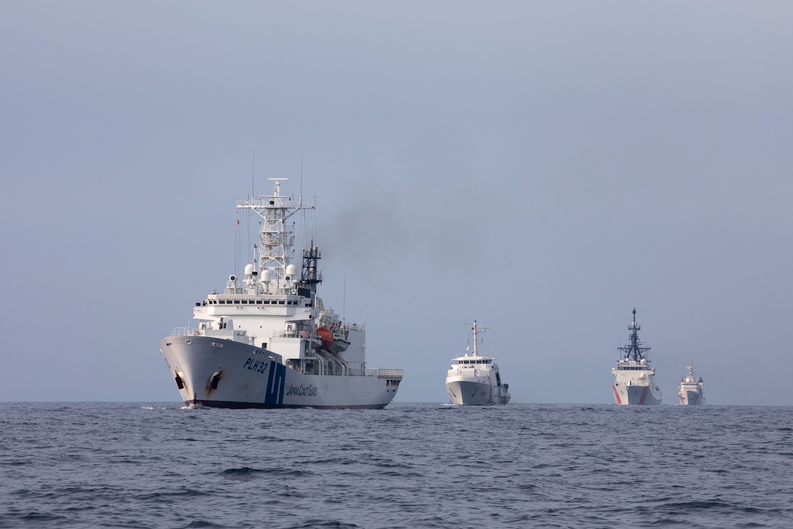 (From left) Japan Coast Guard Vessel Akitsushima (PLH 32), U.S. Coast Guard Cutter Stratton (WMSL 752), Philippine Coast Guard vessels BRP Gabriela Silang (OPV 8301) and BRP Melchora Aquino (MRRV-9702) conduct a trilateral engagement in the South China Sea June 5, 2023. Stratton deployed to the Western Pacific to conduct engagements with regional allies and partner nations, reinforcing a rules-based order in the maritime domain. (U.S. Navy photo by Chief Petty Officer Brett Cote)