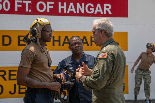 Adm. Meier speaks with Sailors