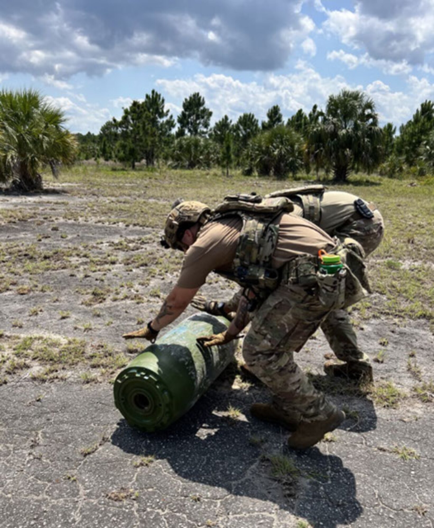 Explosive Ordnance Disposal teams from Fort Stewart, Ga., MacDill Air Force Base (AFB), Fla., Moody AFB, Ga., Cape Canaveral Space Force Station, Fla., and Homestead Air Reserve Base, Fla., participate in a joint total force Agile Combat Employment exercise from May 9-11, 2023, in Palm Bay, Fla. The exercise featured 17 unique scenarios to challenge and enhance their abilities in airbase recovery post-attack and in overcoming area denial techniques. (Courtesy photo by U.S. Air Force Master Sgt. Nicholas Graham)