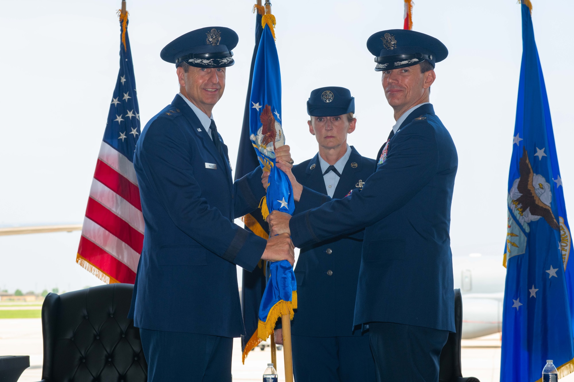 Major General Corey J. Martin, 18th Air Force commander (left), presents a guidon to Col. Cory M. Damon (right), as he assumes command of the 22nd Air Refueling Wing during a change of command ceremony June 9, 2023, at McConnell Air Force Base, Kansas. Prior to taking command of the wing, Damon served as vice commander of the 6th Air Refueling Wing at MacDill Air Force Base, Florida. (U.S. Air Force photo by Staff Sgt. Adam Goodly)