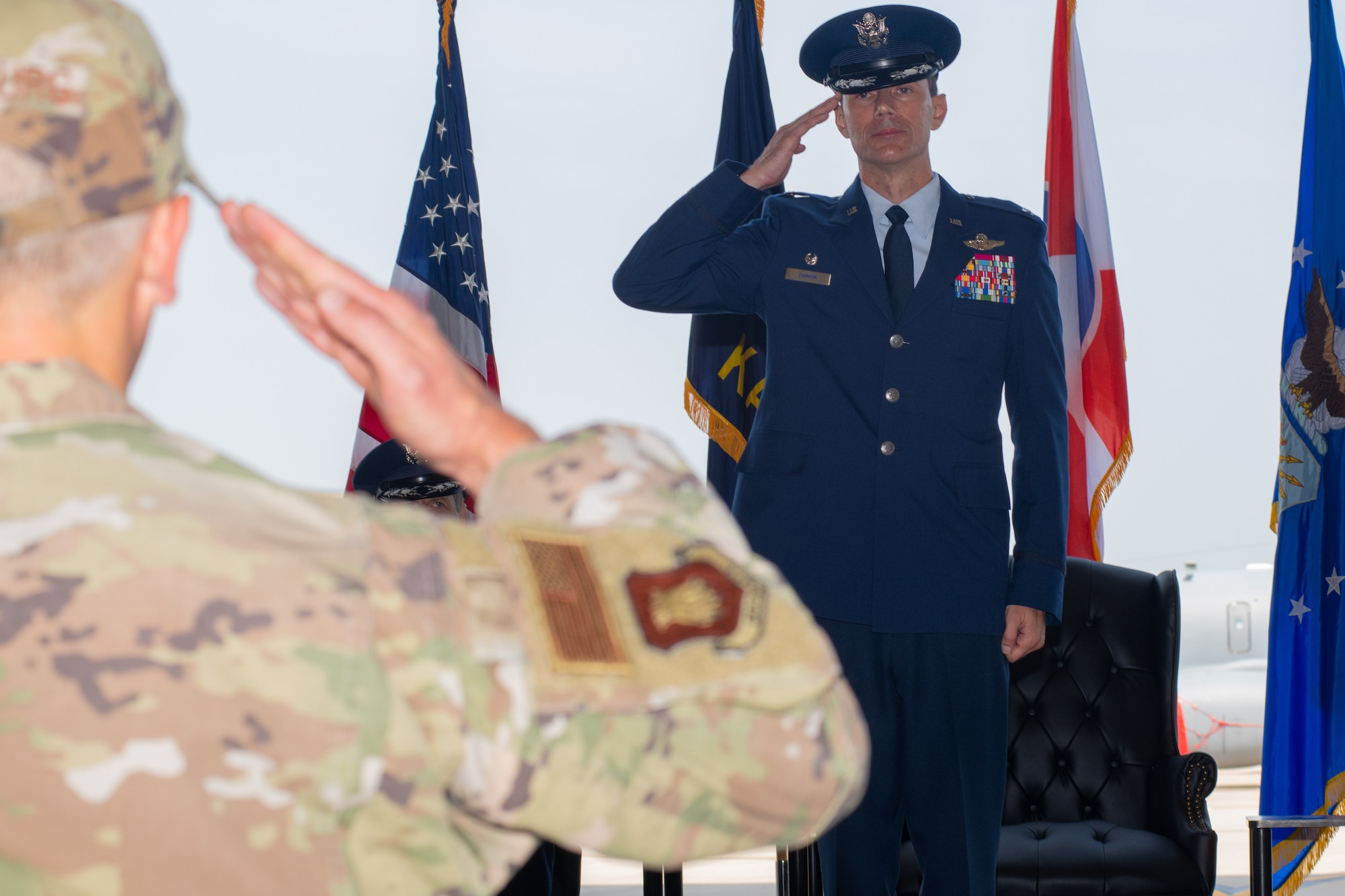 Colonel Cory M. Damon, 22nd Air Refueling Wing commander, renders his first salute to the wing's Airmen at a change of command ceremony June 9, 2023, at McConnell Air Force Base, Kansas. The change of command is a traditional military ceremony in which the departing commander assembles troops for presentation to the incoming commander. (U.S. Air Force photo by Staff Sgt. Adam Goodly)