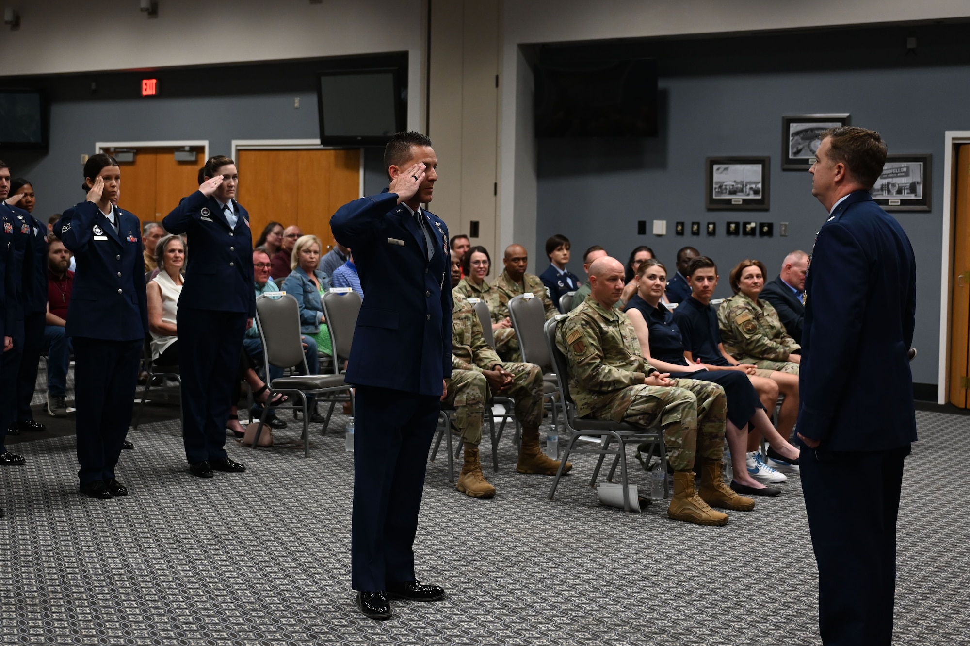 Members of the 313th Training Squadron salute U.S. Air Force Lt. Col. Daniel Blackledge, outgoing 313th Training Squadron commander, during the change of command ceremony at the Powell Event Center, Goodfellow Air Force Base, Texas, June 9, 2023. The squadron’s salute represents a “thank you” to the outgoing commander for their leadership. (U.S. Air Force photo by Airman 1st Class Madison Collier)