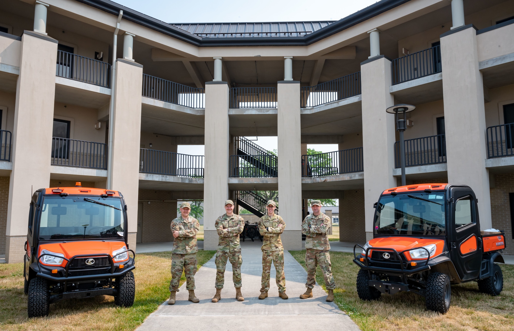 From the left, Tech. Sgt. Adam Thompson, Staff Sgt. James Sorensen and Joshua Hicks, and Master Sgt. Christopher Harris, all 436th Civil Engineer Squadron airman dorm leaders, pose for a group photo in front of the dormitories at Dover Air Force Base, Delaware, June 7, 2023. ADL is a three year special duty assignment that Staff Sergeants and above can apply to. (U.S. Air Force photo by Airman 1st Class Amanda Jett)