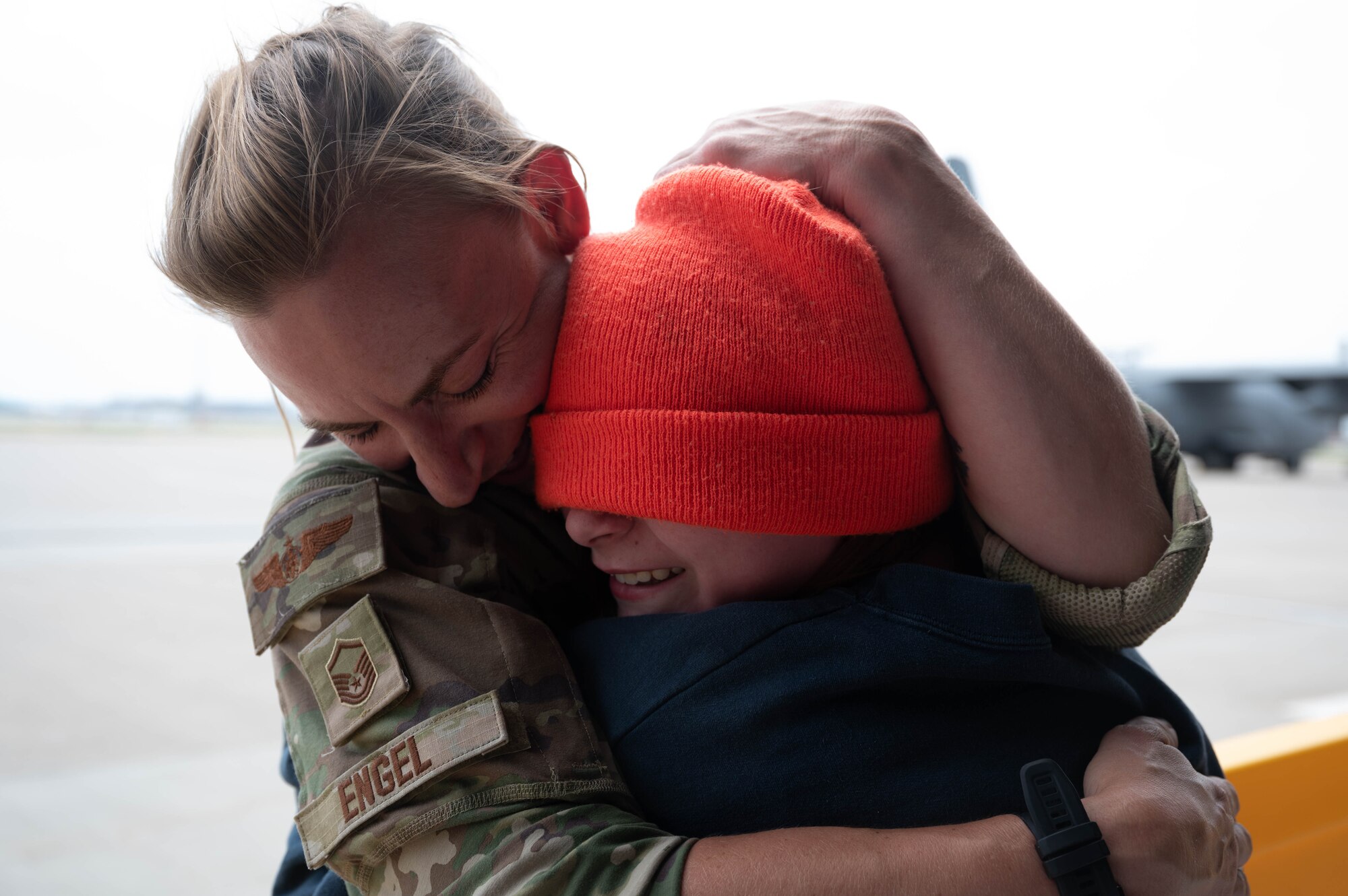 Master Sgt. Kelly Engel, 96th Airlift Squadron loadmaster, hugs her daughter, Anelia Conley, after arriving home from a three-month deployment at Minnesota-St. Paul Air Reserve Station, Minnesota, June 5, 2023. Engel and approximately 150 other 934 Airlift Wing Airmen returned home from a deployment to Djibouti in support of Operation East Africa Counterterrorism’s mission. (U.S. Air Force photo by Chris Farley)