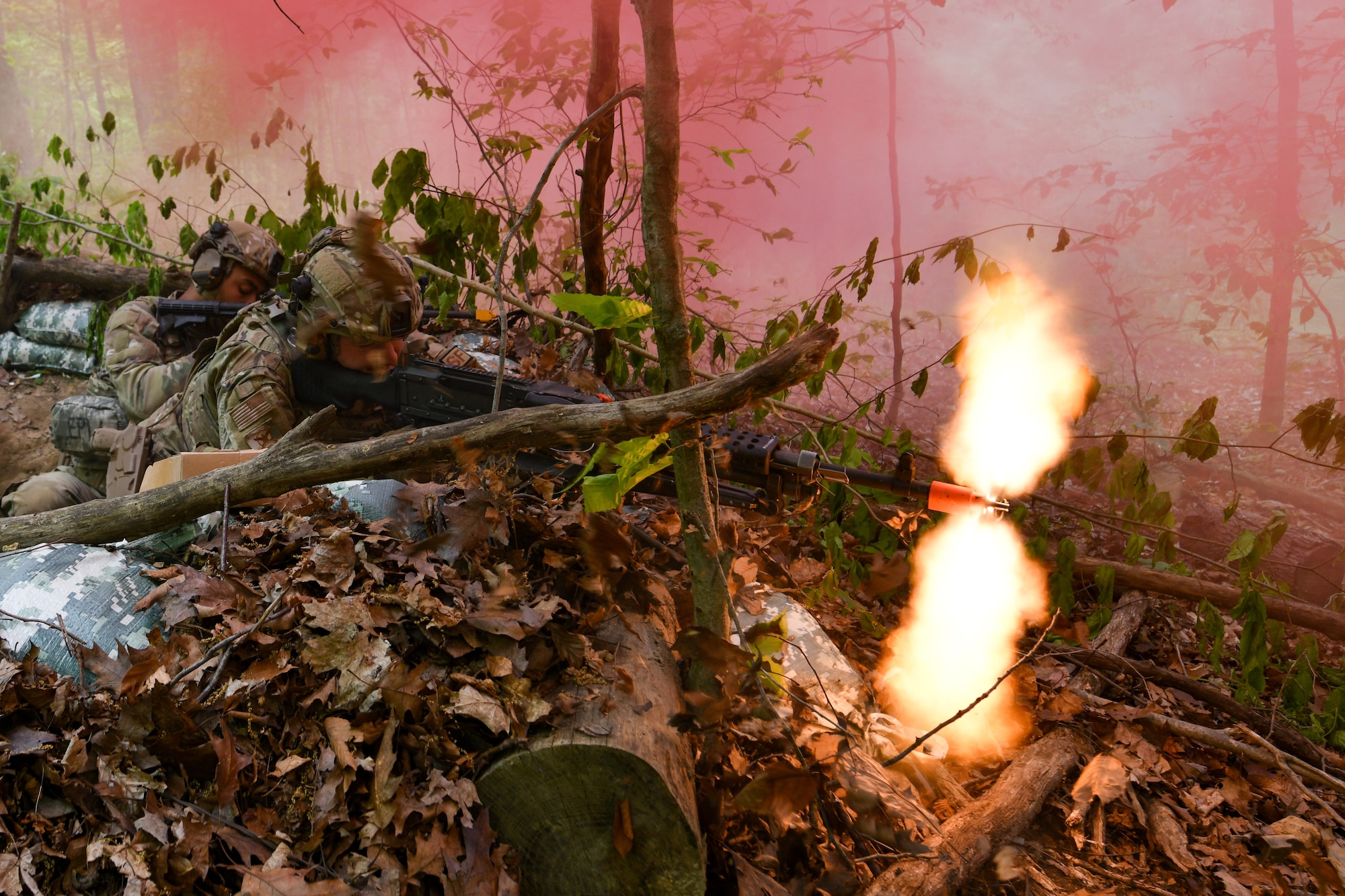 Senior Airman Dylan Milbrand, a member of the 914th Security Forces Squadron, Niagara Falls Air Reserve Station, New York, fires blank rounds from his M240 machine gun during a static defense exercise, May 19, 2023, at Camp James A. Garfield Joint Military Training Center, Ohio.