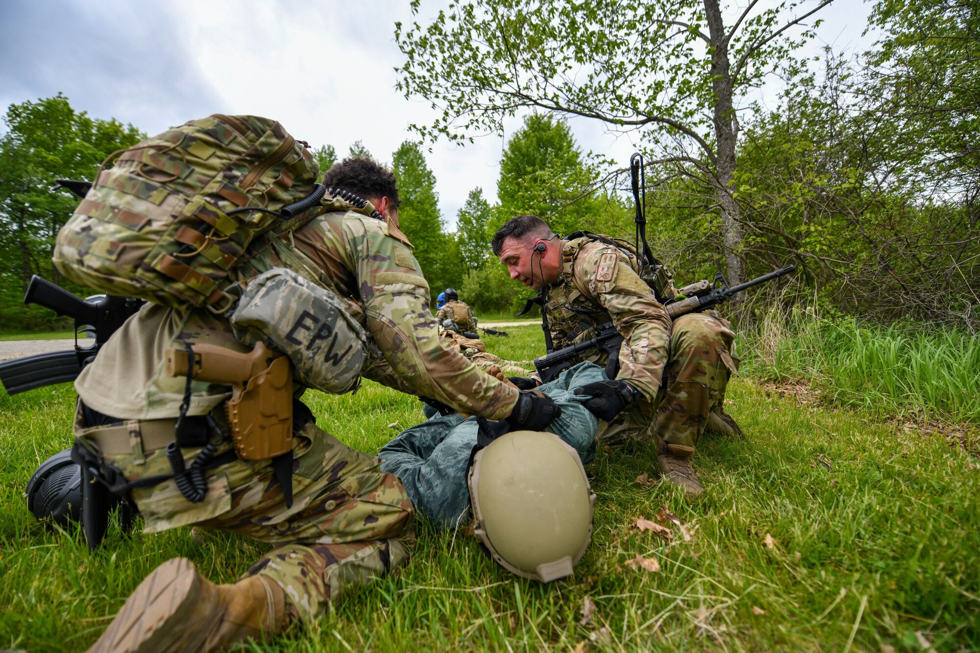 Tech. Sgt. Tim Caudle and Senior Airman Chris Brosius, both members of 914th Security Forces Squadron, Niagara Falls Air Reserve Station, New York, search an opposing force member for intel during an area security operations exercise at the Integrated Defense Leadership Course at Camp James A. Garfield Joint Military Training Center, Ohio, May 19, 2023.