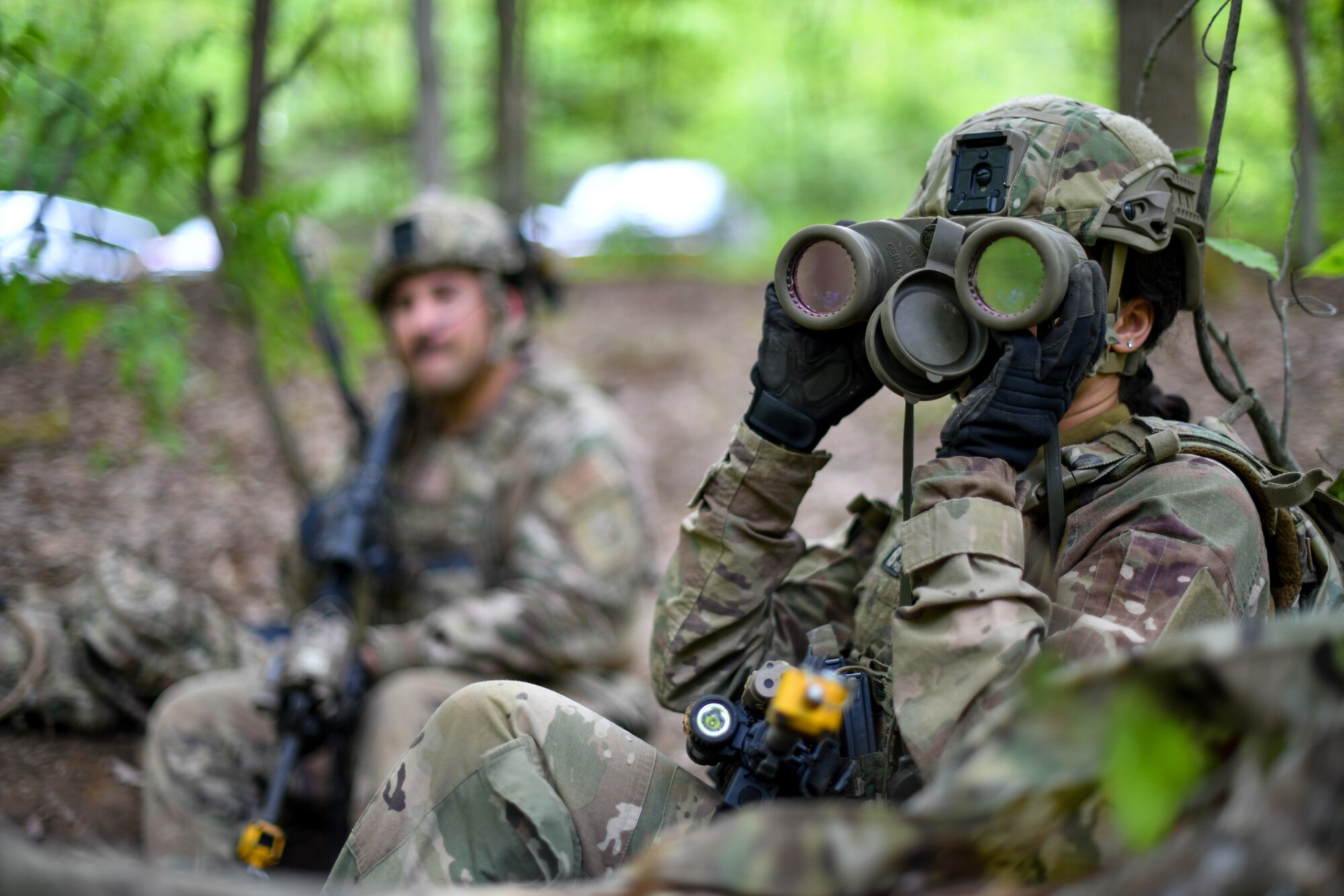 Staff Sgt. Ashley Maxwell, a member of the 914th Security Forces Squadron, Niagara Falls Air Reserve Station, New York, scans her surroundings during a static defense exercise, May 19, 2023, at Camp James A. Garfield Joint Military Training Center, Ohio.