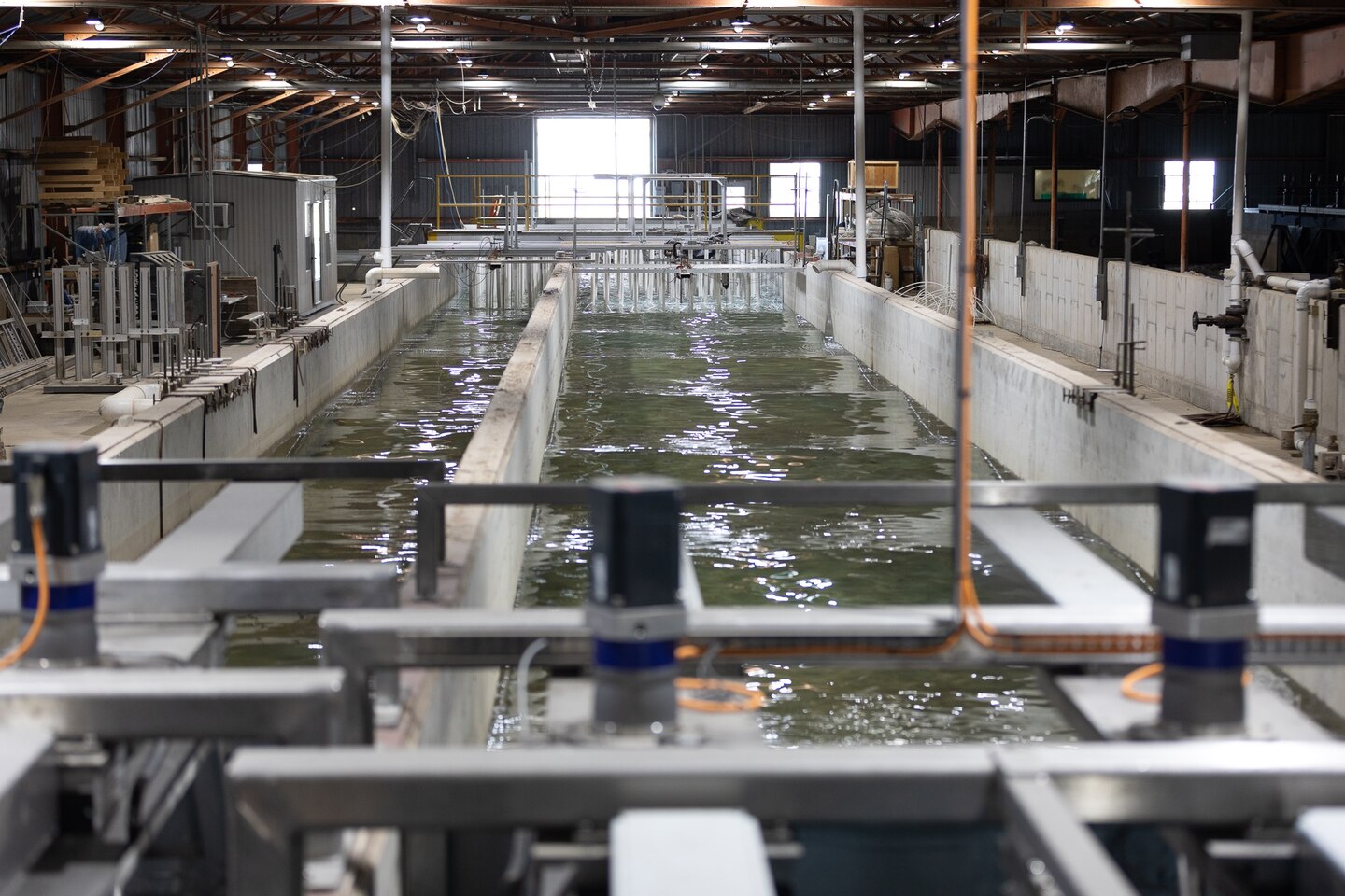 Two glass-walled wave flumes are used to support research and site-specific studies. The flumes are both 63 m (208 ft) long and 1.5 m (5 ft) deep. One flume is 1.5 m (5 ft) wide while the other is 3 m (10 ft) wide. Both two-dimensional glass-walled flumes are equipped with computer-controlled electro-hydraulic wave generators. The wave generators are capable of creating irregular waves with a maximum wave height of 0.46 m (1.5 ft), and wave periods of 0.75-10.0 secs. A steady flow system is also an integral part of the flumes. The facility includes an automated data acquisition and control system, extensive fluid measurement instruments and a laser profiling system.