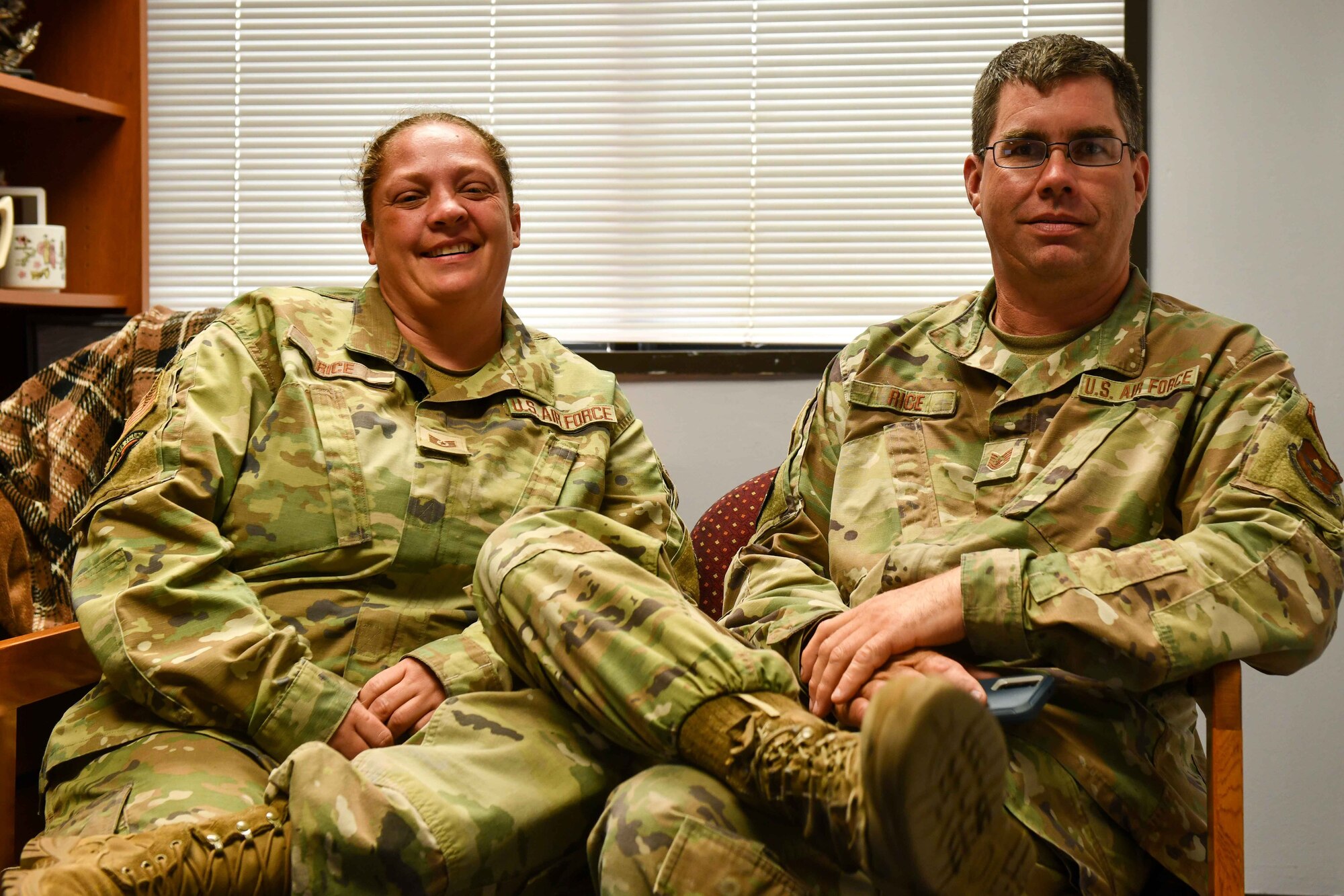 U.S. Air Force Tech. Sgt. Crystal Rice, 97th Force Support Squadron manpower and organization noncommissioned officer in charge poses with her husband, Tech. Sgt. Charles Rice, 97th Civil Engineer Squadron electrical power production noncommissioned officer in charge, at Altus Air Force Base, Oklahoma, June 7, 2023. The couple retired together on June 9, 2023. (U.S. Air Force photo by Airman 1st Class Kari Degraffenreed)