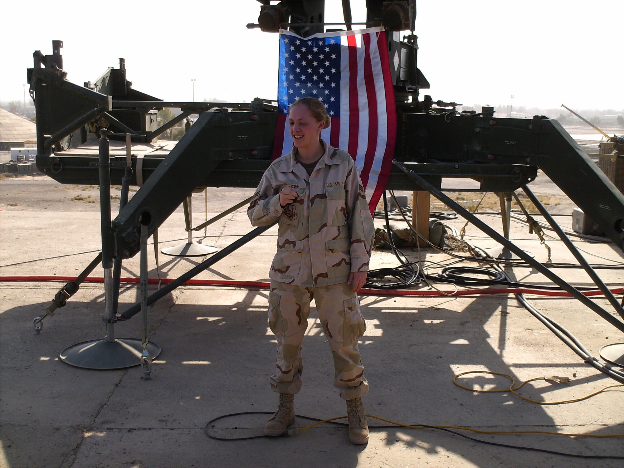 U.S. Air Force Tech. Sgt. Crystal Rice, 97th Force Support Squadron manpower and organization noncommissioned officer in charge, pictured as a Senior Airman, prepares for her reenlistment at Balad Air Base, Iraq in 2007. Rice joined the Air Force in October 2002. (Photo courtesy of Tech. Sgt. Crystal Rice)