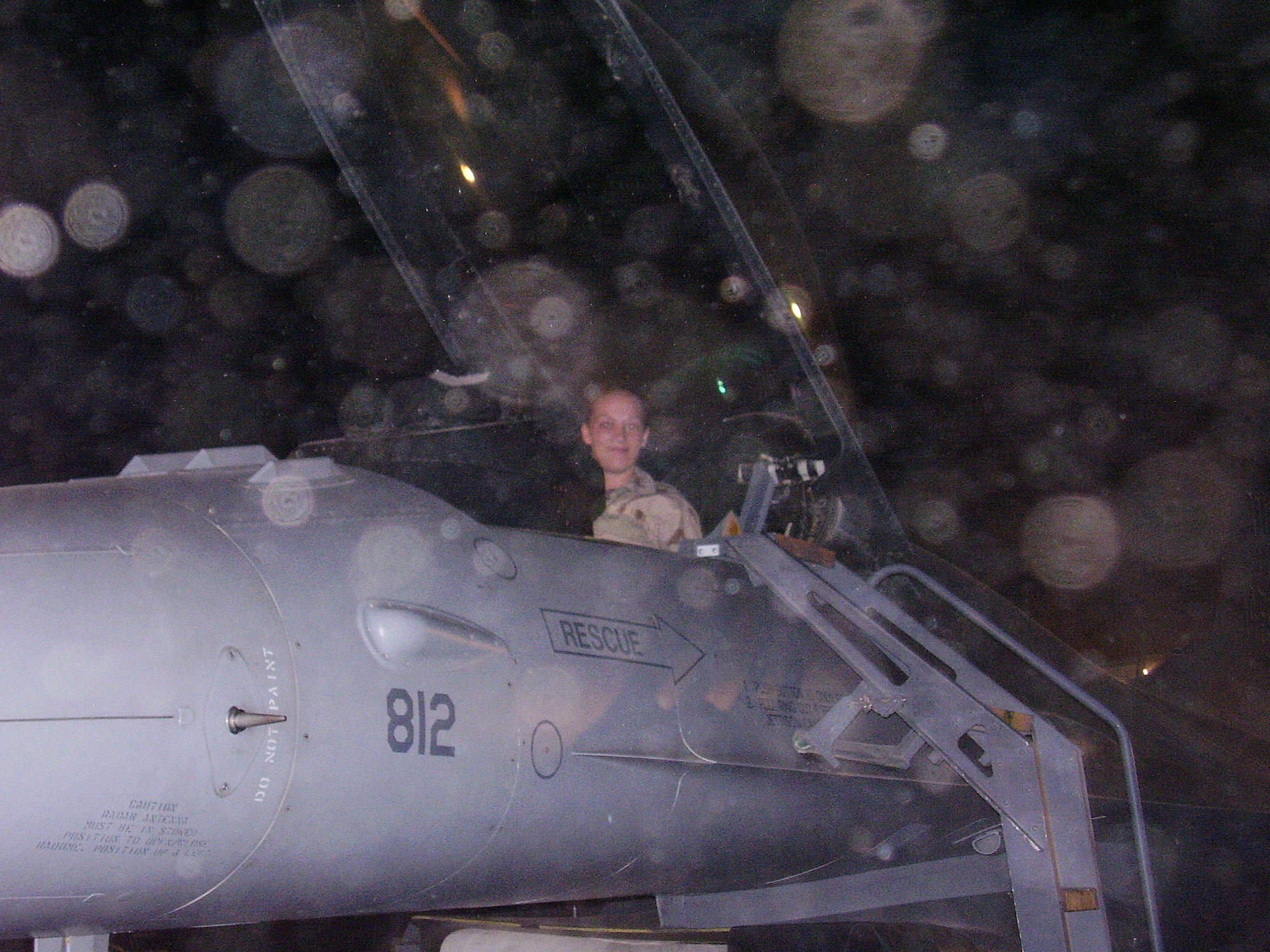 U.S. Air Force Tech. Sgt. Crystal Rice, 97th Force Support Squadron manpower and organization noncommissioned officer in charge, pictured here as a Senior Airman, poses in anF-16 Fighting Falcon at Balad Air Base, Iraq in 2007. Rice has been deployed seven times during her 20 years of military service. (Photo courtesy of Tech. Sgt. Crystal Rice)