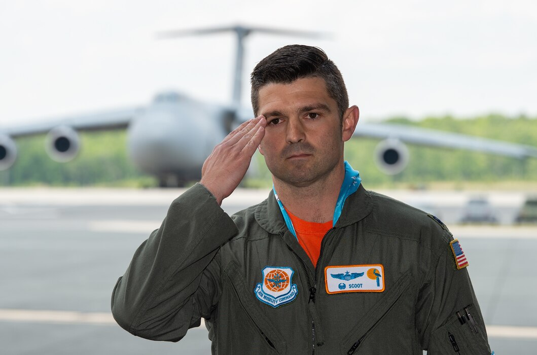 Lt. Col. Phillip Summers, 9th Airlift Squadron commander, accepts his first salute during the 9th AS change of command ceremony at Dover Air Force Base, Delaware, June 9, 2023. The 9th AS routinely trains to provide global reach with unique outsized and oversized airlift capability on the C-5M Super Galaxy. (U.S. Air Force photo by Roland Balik)