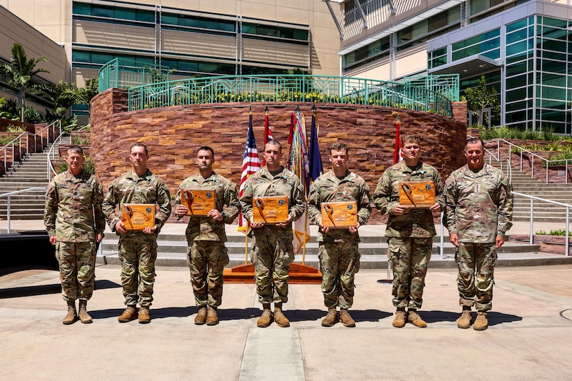 Gen. Charles Flynn, U.S. Army Pacific commanding general, and Command Sgt. Maj. Scott A. Brzak, U.S. Army Pacific senior enlisted advisor, presented awards to the 11th Airborne Division for winning the U.S. Army Pacific Best Squad competition held on Fort Shafter, Hawaii, June 8, 2023.