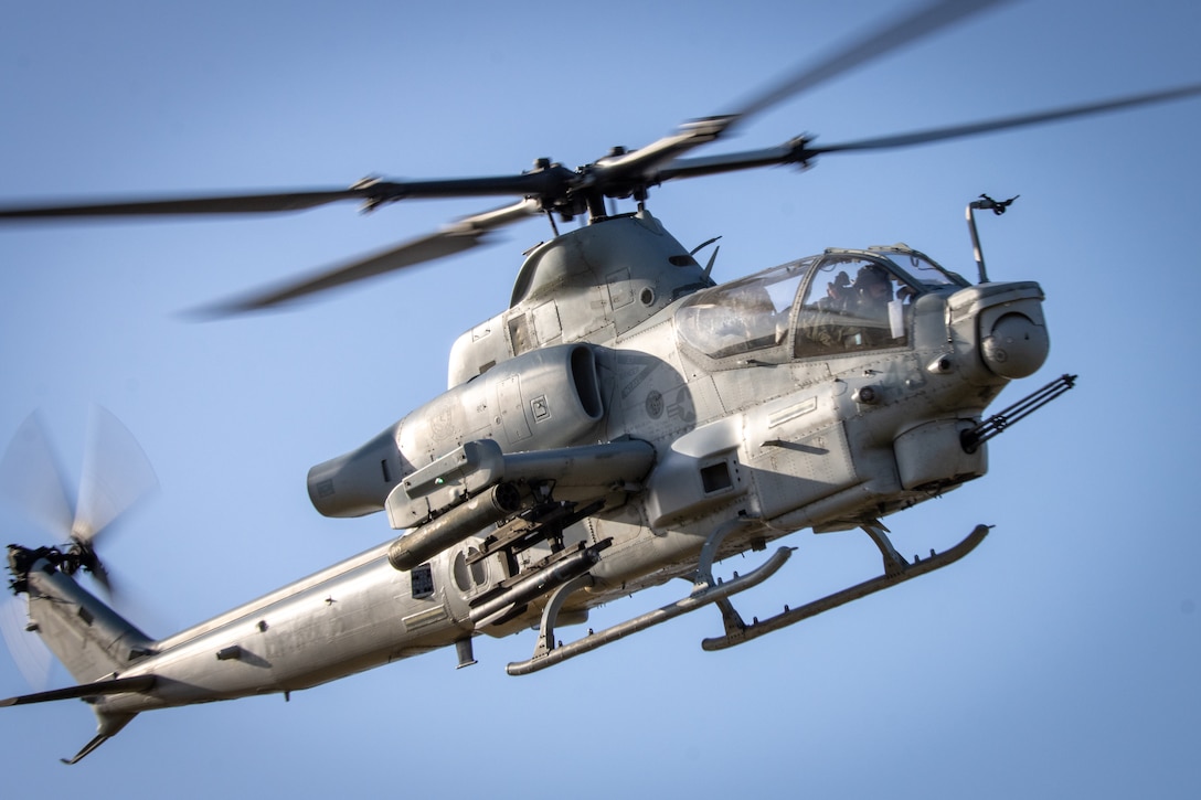 A U.S. Marine Corps AH-1Z Viper, with Light Attack Helicopter Squadron 367, Marine Aircraft Group 39, 3rd Marine Aircraft Wing, flys over the training area during a close air support exercise as part of United Arab Emirates Unit Enhancement Training at Marine Corps Base Camp Pendleton, California, May 10, 2023. The intent of UAE Unit Enhancement Training is to further develop and reinforce partner relations and enhance United Arab Emirates soldiers knowledge of Marine Corps tactics and procedures in indirect fire and close air support. (U.S. Marine Corps photo by Lance Cpl. Henry)