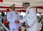 Vice Adm. Karl Thomas, Commander of U.S. Seventh Fleet (right), coins Laksamana Tni Yudo Margon, Panglima Tentara Nasional Indonesia, during the opening ceremony of Multination Naval Exercise Komodo 2023 (MNEK 2023). MNEK 2023 is a military exercise held by the Indonesian to establish cooperation in regional area, especially in carrying out disaster management and humanitarian assistance operations. Under Commander, U.S. Pacific Fleet, 7th Fleet is the U.S. Navy's largest forward-deployed numbered fleet, and routinely interacts and operates with maritime nations in preserving a free and open Indo-Pacific region. (U.S. Navy photo by Mass Communication Specialist 2nd Class Christopher Thomas)
