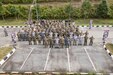 Malaysian and United States Armed Forces service members pose for a group photo after the Exercise Bersama Warrior 23 opening ceremony at the Joint Warfighting Center on Malaysian Armed Forces Headquarters Base, Kuantan, Padang, Malaysia, June 6, 2023.