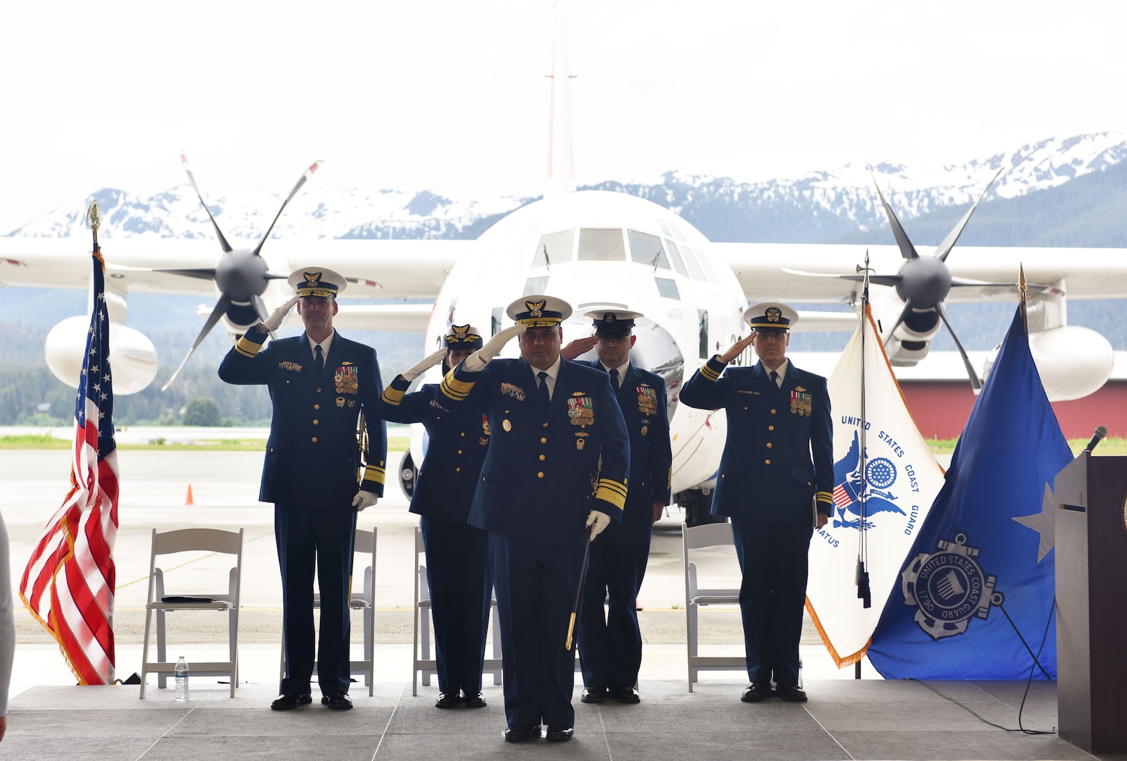 Rear Admiral Megan Dean, Seventeenth district commander, speaks during the Coast Guard 17th District change-of command ceremony at the Alaska Army National Guard Army Aviation Operating Facility in Juneau, Alaska, June 8, 2023.
 
Rear Adm. Nathan Moore transferred the command of the Coast Guard’s 17th District to Rear Adm. Megan Dean under the supervision of Vice Adm. Andrew J. Tiongson.
 
As the 17th District commander, Dean, will be responsible for all Coast Guard operations throughout Alaska, the North Pacific and the Arctic which includes protecting life and property, enforcing federal laws and treaties, preserving living marine resources, and promoting national security. Headquartered in Juneau, the 17th District encompasses 3.8 million square miles and over 44,000 miles of shoreline. During an average year the 2,500 active duty, reserve, civilian and auxiliary personnel of the 17th District save 264 lives and assist 636 people.
 
Dean was previously assigned as the Coast Guard director of governmental and public affairs. She was responsible for responsible for external engagement with Congress, the media, and other inter-governmental entities.
 
Moore, who originally took command of the 17th District in April 2021, is transferring to Portsmouth, VA., where he will serve as the deputy commander for Coast Guard Atlantic Area.
  
A change-of-command ceremony marks a transfer of total responsibility and authority from one individual to another. It is a time-honored tradition conducted before the assembled crew, as well as honored guests and dignitaries to formally demonstrate the continuity of the authority within a command