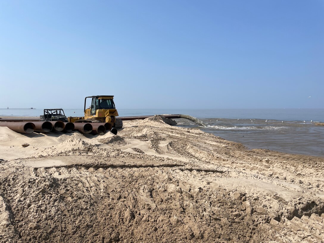 King Co., Inc. employees grade sand along the beach north of Grand Haven, Michigan for a contract with the U.S. Army Corps of Engineers, Detroit District, June 9, 2023. The dredging work is expected to be completed in mid-July.