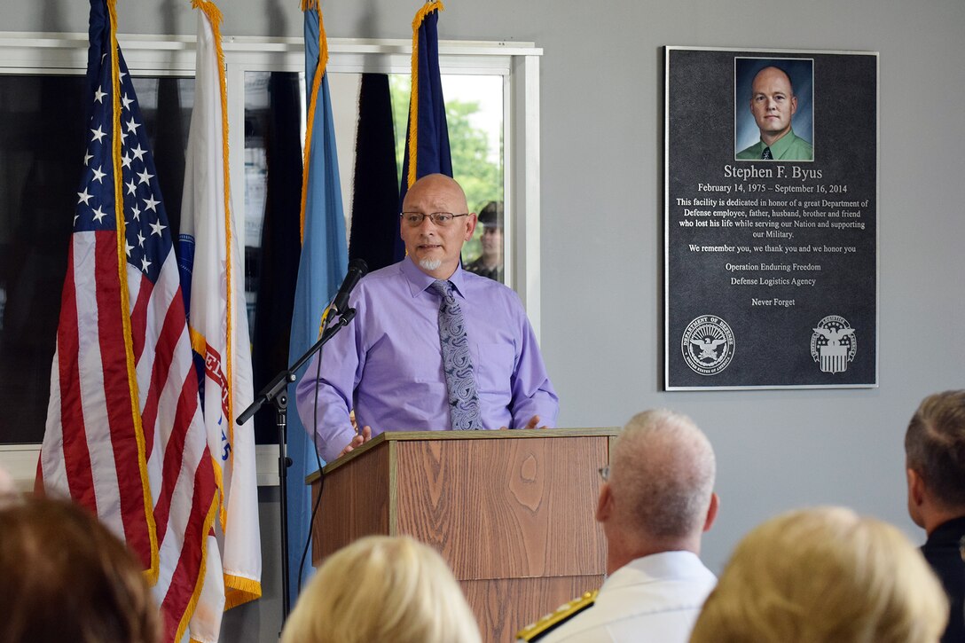 The Army Expeditionary Civilian Workforce alongside Defense Logistics Agency senior leaders and the family of Stephen Byus officially opened the Stephen Byus Central Issue Facility Warehouse June 8 during a memorialization ceremony at Camp Atterbury, Indiana.