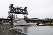 USS Kansas City (LCS 22) passes underneath Portland's Steel Bridge.