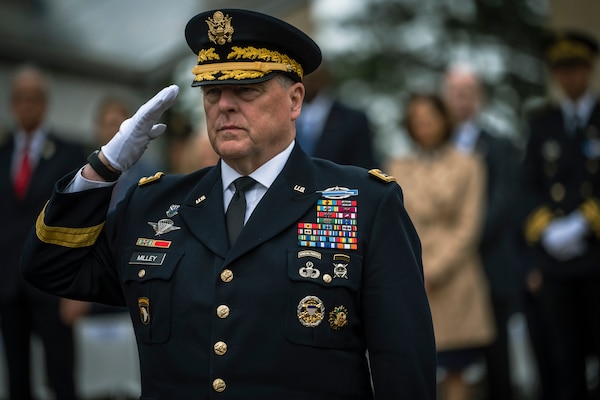 Chairman of the Joint Chiefs of Staff Army Gen. Mark A. Milley salutes after laying a wreath at commemorating the 79th anniversary of the D-Day invasion on the beaches of Normandy, France, during World War II, June 6, 2023. Milley says new technologies mean the character of war will change in the coming decades.
