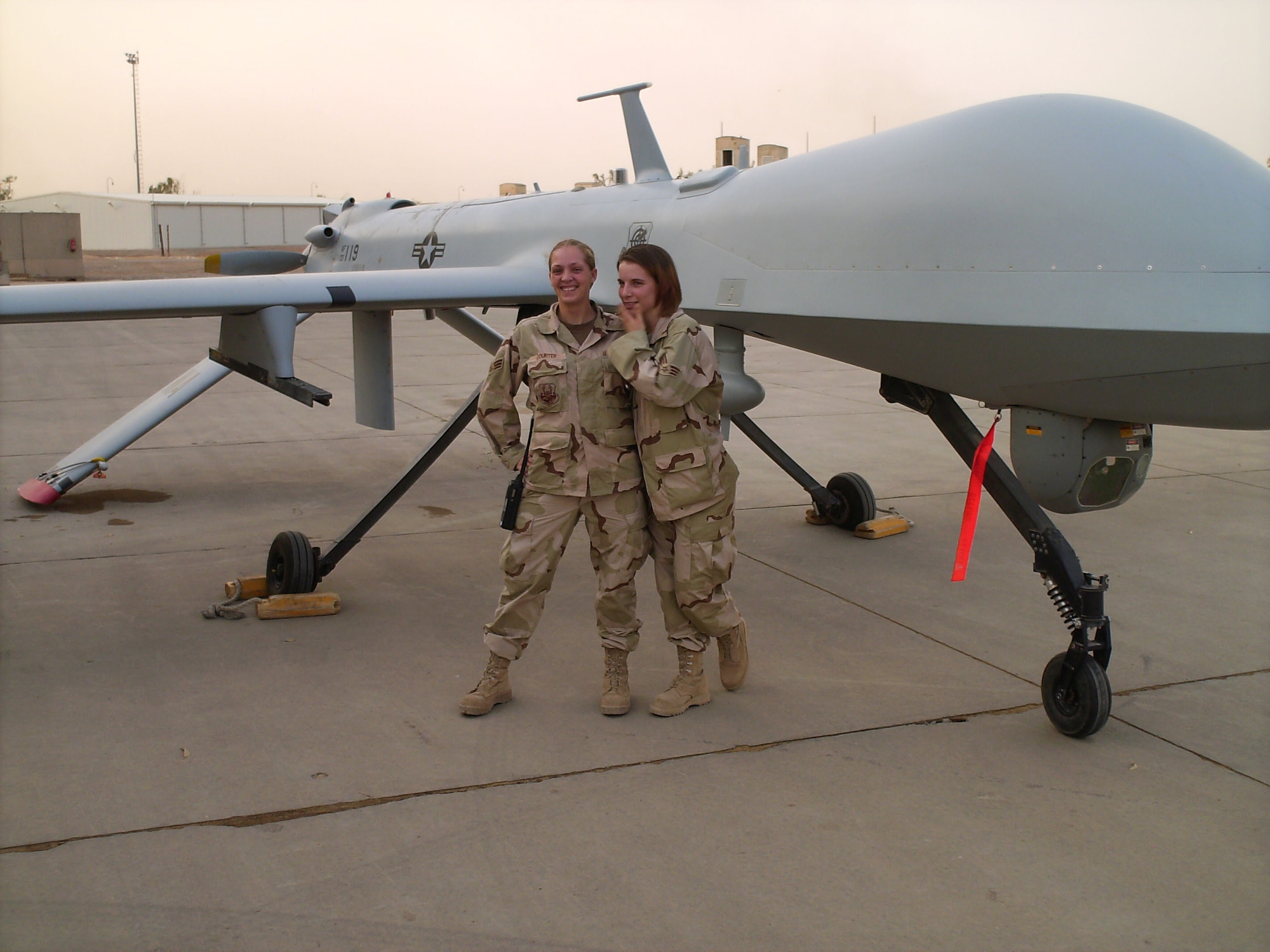U.S. Air Force Tech. Sgt. Crystal Rice, 97th Force Support Squadron manpower and organization noncommissioned officer in charge, pictured as a Senior Airman, poses with Senior Airman Kerri Blanchard, during a deployment at Balad Air Base, Iraq in 2007. Rice began her career in air control warning systems before retraining into manpower 11 years later. (Photo courtesy by Tech. Sgt. Crystal Rice)