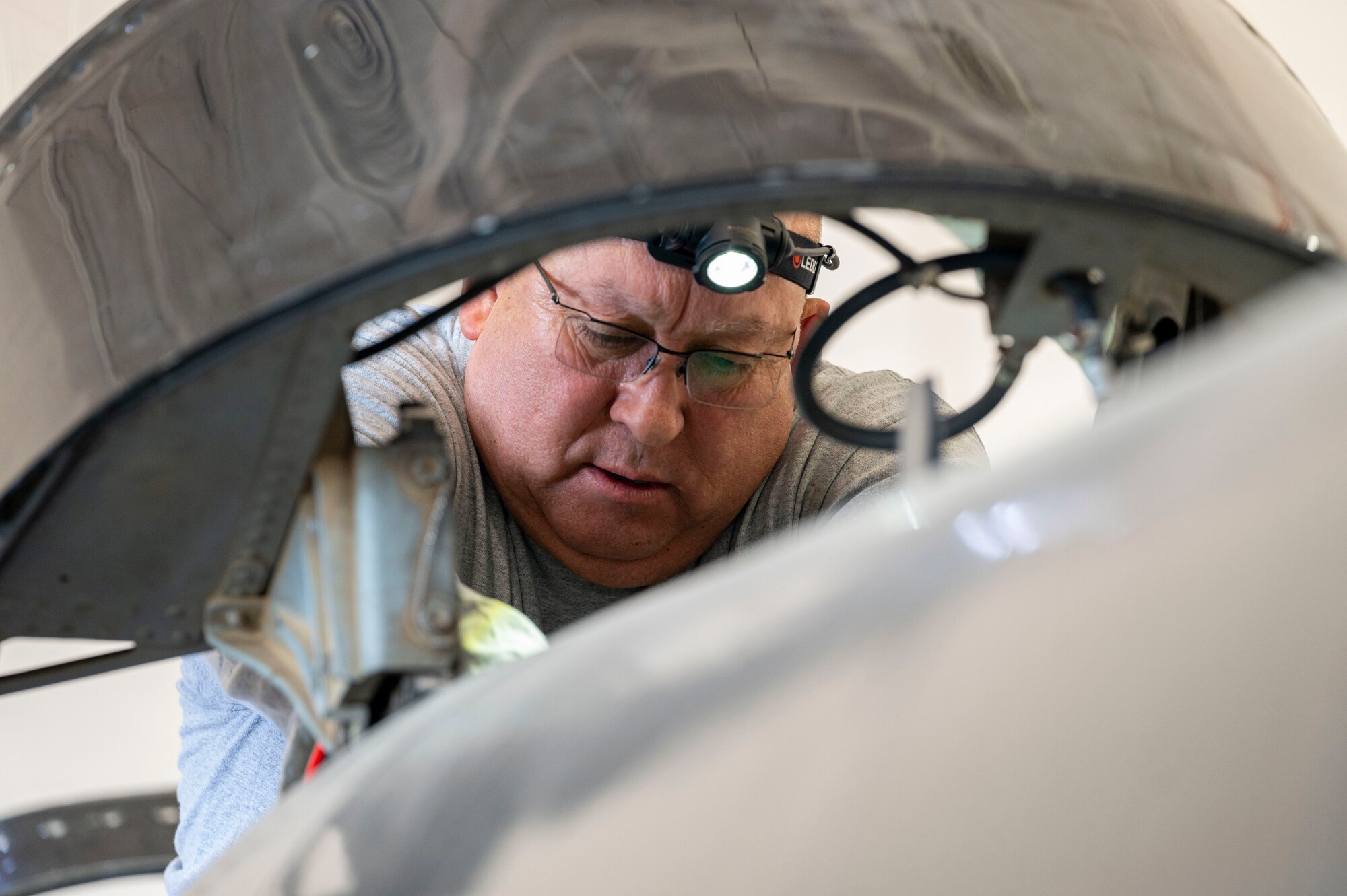 Jose Ochoa, T-38 Aircraft Maintenance Program egress technician, performs maintenance on the cockpit of a T-38A/B Talon at Holloman Air Force Base, New Mexico, June 8, 2023.