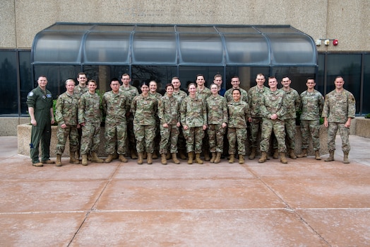  Military members in uniform pose for a group photo