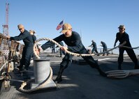 230610-N-DE439-1271 Agadir, Morocco (June 10, 2023) Sonar Technician (Surface) 2nd Class Corey Miller leads a mooring line aboard the Arleigh Burke-class guided-missile destroyer USS Arleigh Burke (DDG 51) during a sea and anchor evolution, June 10, 2023. Arleigh Burke is on a scheduled deployment in the U.S. Naval Forces Europe area of operations, employed by U.S. Sixth Fleet to defend U.S., allied and partner interests. (U.S. Navy photo by Mass Communication Specialist 2nd Class Almagissel Schuring)