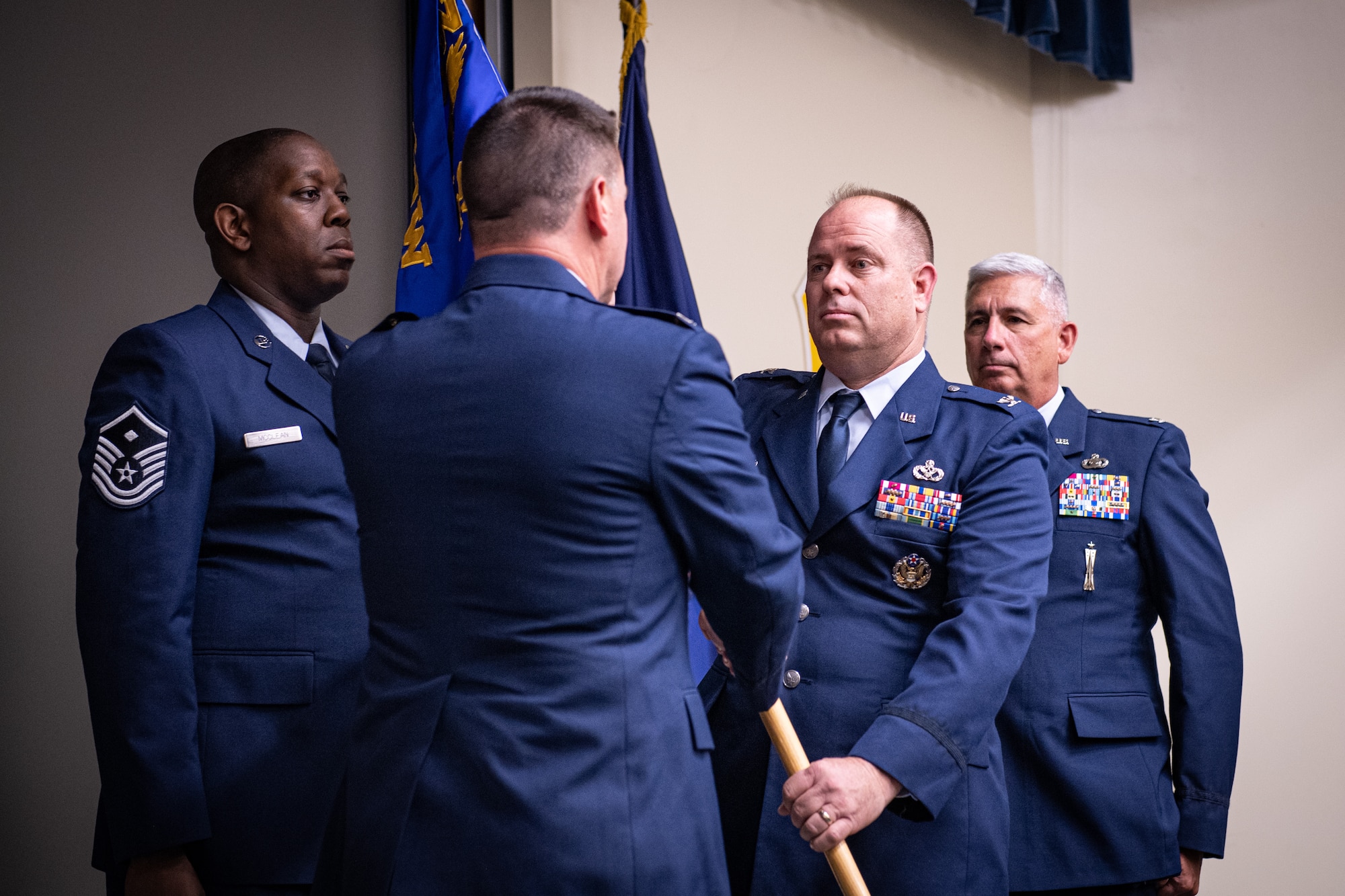 U.S. Air Force Col. Joel Sattazahn, right, 193rd Special Operations Mission Group commander, accepts the unit guidon from Col. Edward Fink, 193rd Special Operations Wing commander, during a change of command ceremony June 10 2023, in Middletown, Pennsylvania.