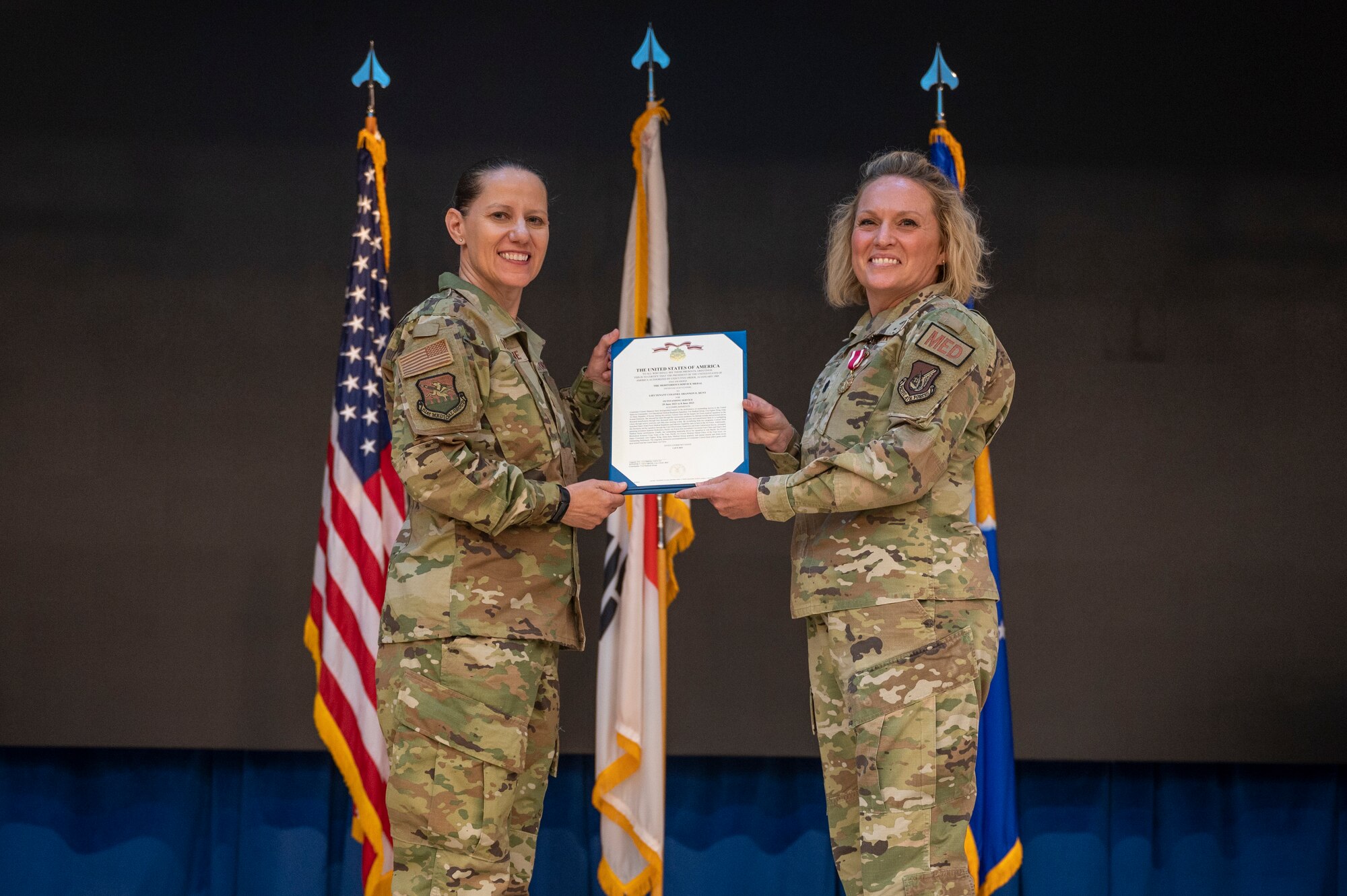 U.S. Air Force Col. Jennifer Vecchione, left, 51st Medical Group commander, presents a Meritorious Service Medal to Lt. Col. Shannon Hunt, 51st Operational Medical Readiness Squadron outgoing commander, at Osan Air Base, Republic of Korea, June 8, 2023. The MSM is a military decoration awarded by various branches of the Armed Forces to recognize distinguished or outstanding meritorious service. (U.S. Air Force photo by Airman 1st Class Aaron Edwards)