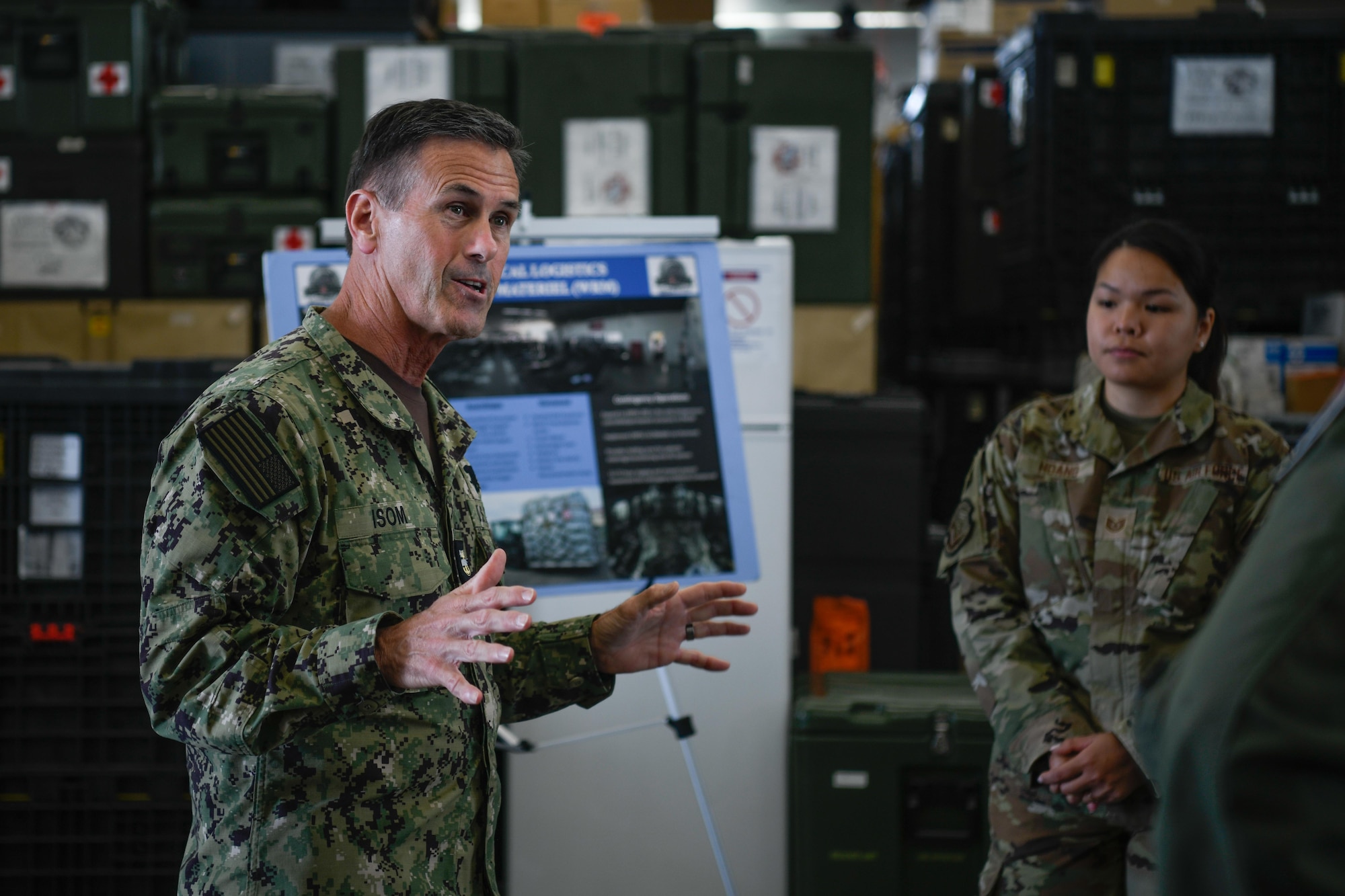 U.S. Navy Fleet Master Chief David Isom speaks with service members.