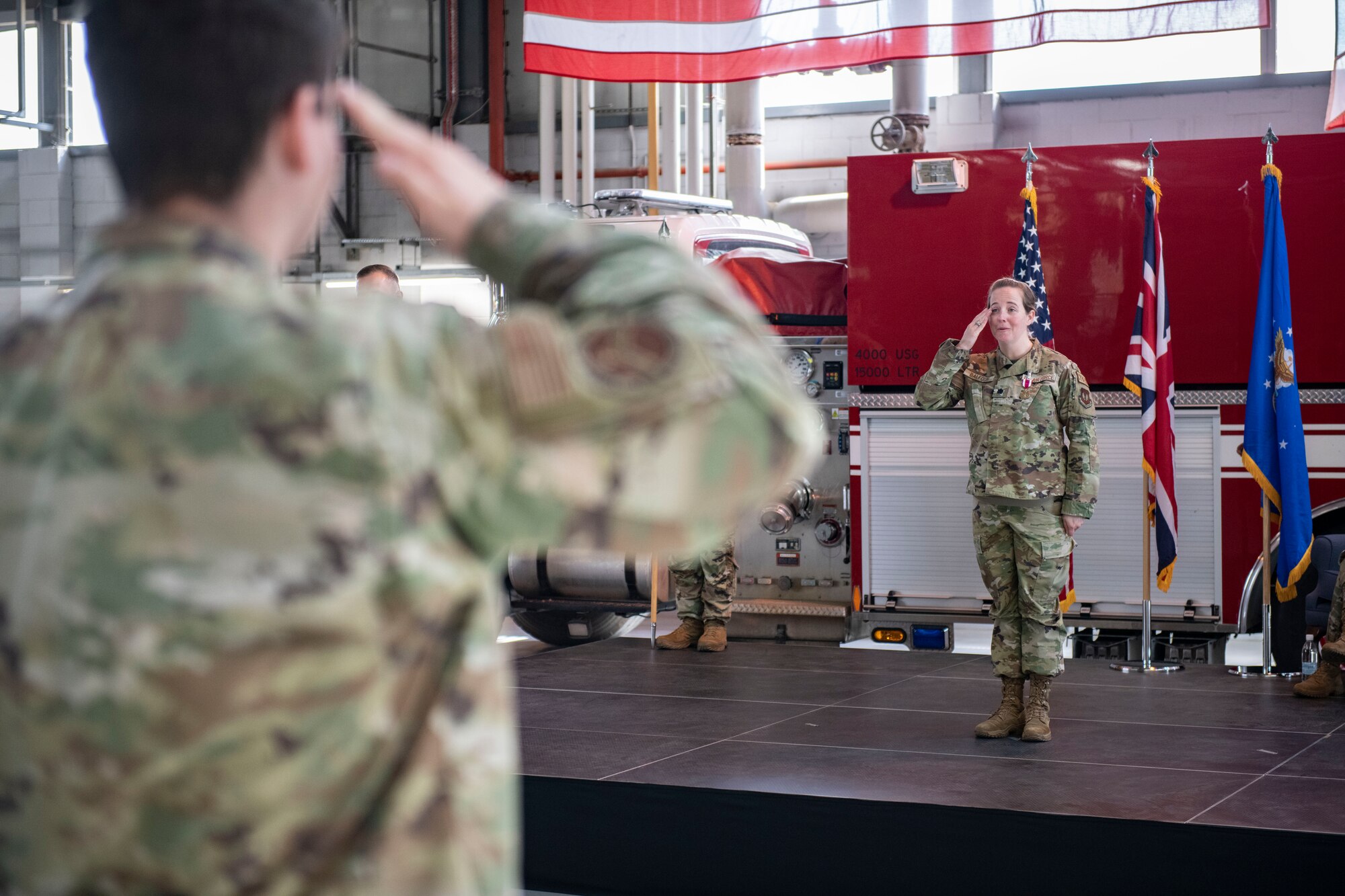Lt. Col. Erica Balfour, 423d Communications Squadron outgoing commander, right, receives her final salute as commander of the 423d CS at RAF Alconbury