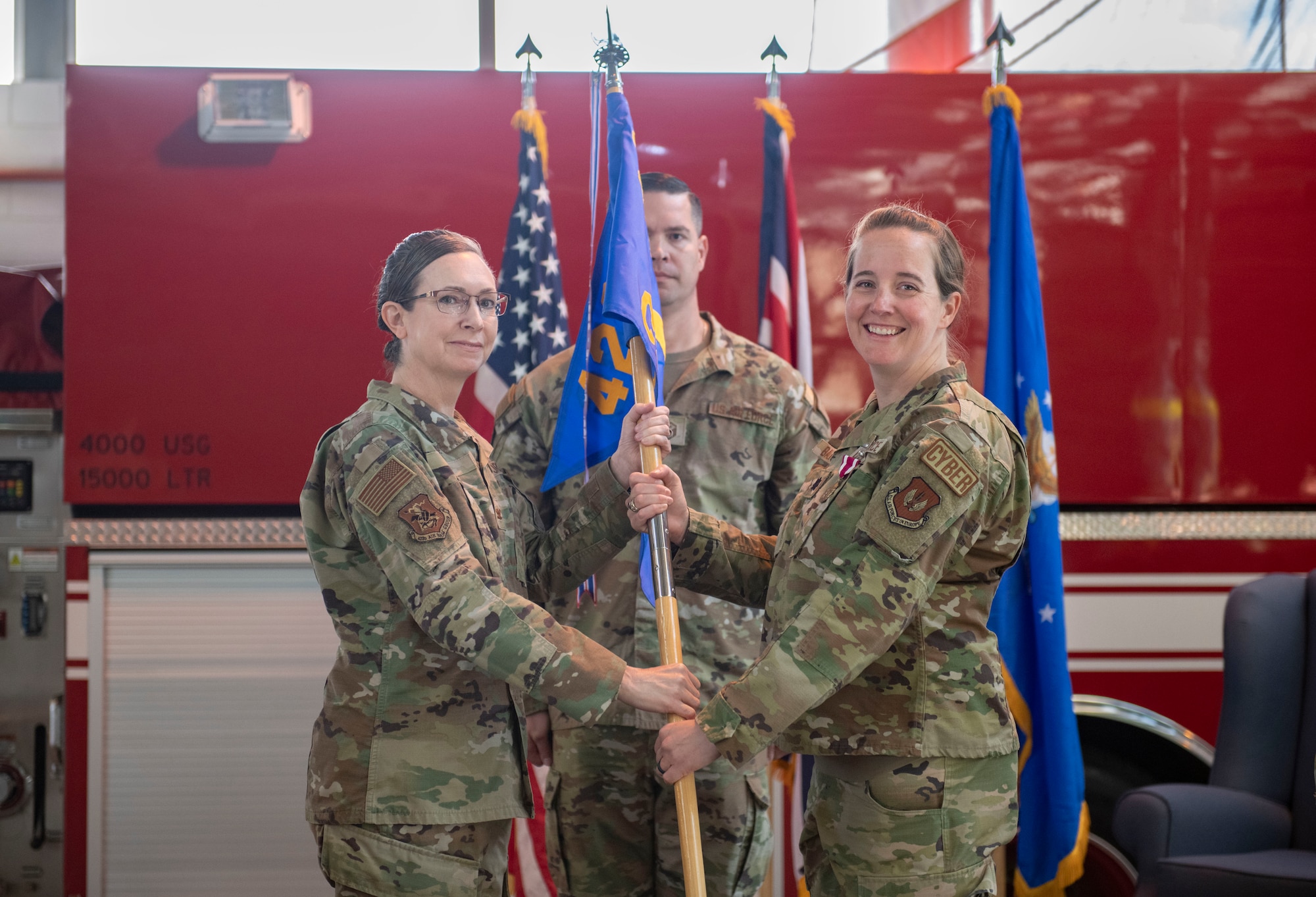Lt. Col. Erica Balfour, 423d Communications Squadron outgoing commander, right, relinquishes command of the 423d CS to Col. Valerie Long, 423d Air Base Group commander, at RAF Alconbury