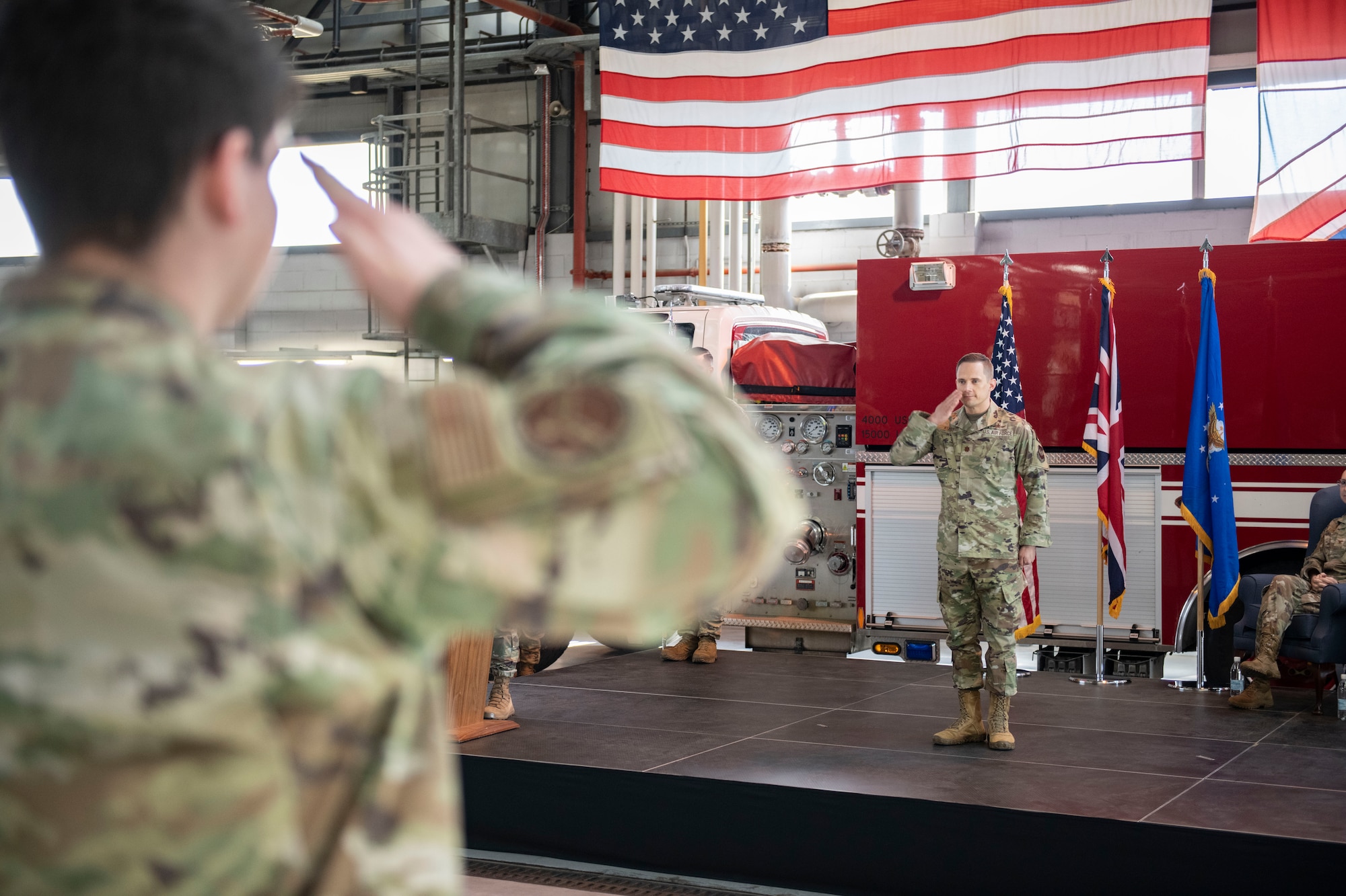 Maj. John Kust, 423d Communications Squadron incoming commander, right, receives his first salute as commander of the 423d CS at RAF Alconbury