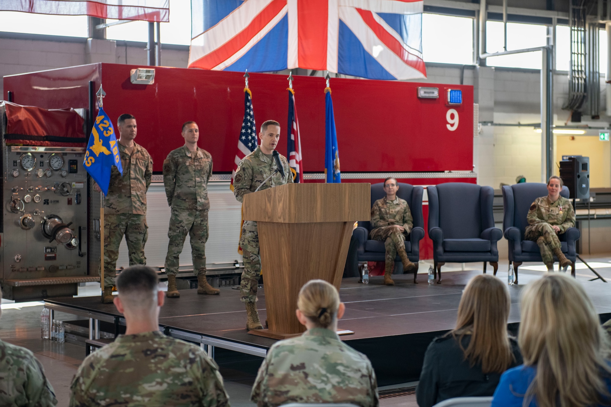 Maj. John Kust, 423d Communications Squadron incoming commander, right, speaks at RAF Alconbury