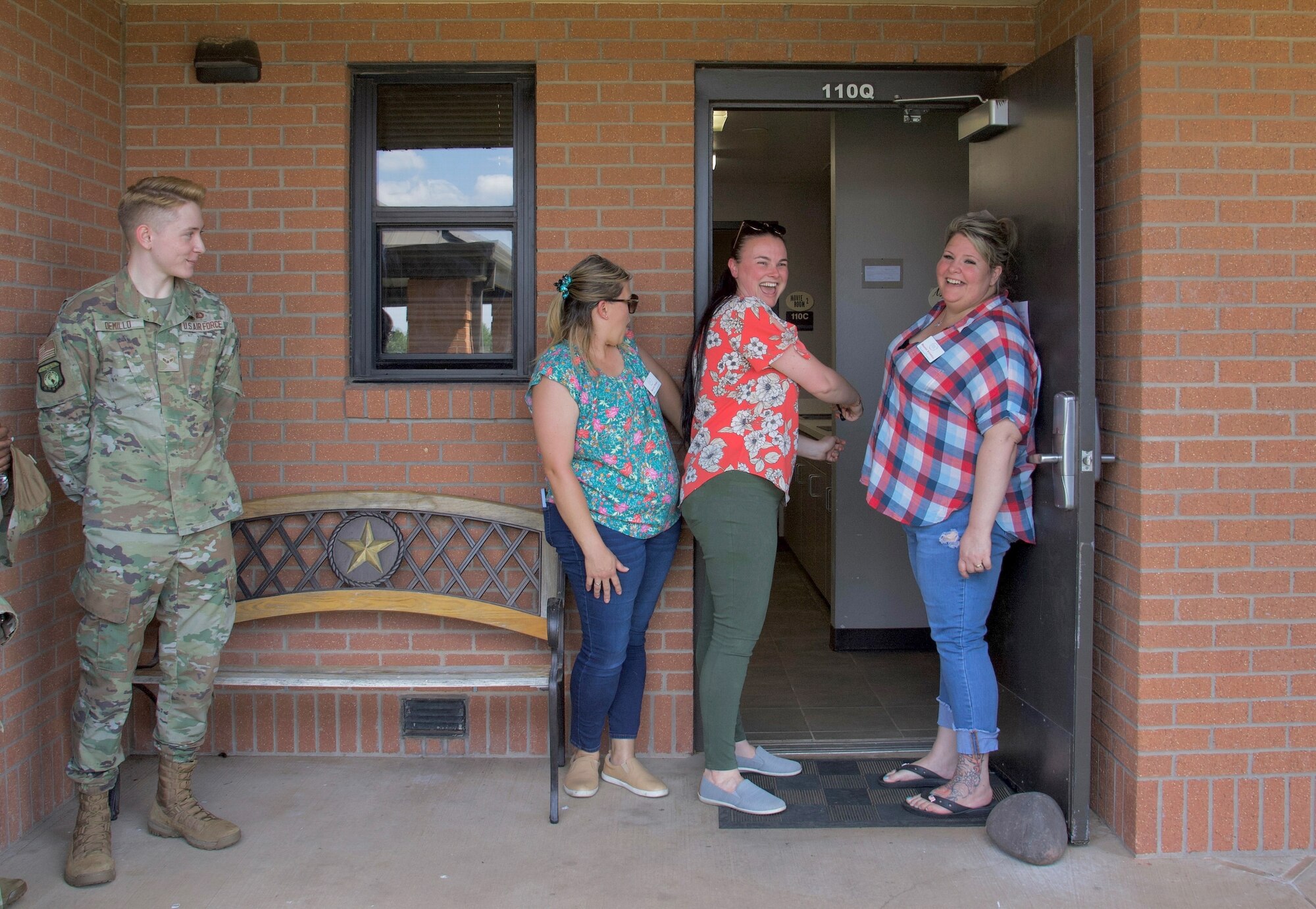 Members of the Dorm Council pose during the opening of the new day room June 2, 2023, at Sheppard Air Force Base, Texas. The Sheppard Spouses Club donated $1,800 to support the new day room for permanent party service members. (U.S. Air Force photo by Airman 1st Class Katie McKee)