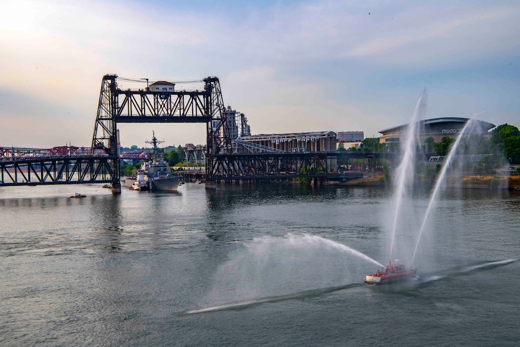Portland Fire and Rescue Fire Boat sprays water Arleigh Burke-class guided-missile destroyer, USS John S. McCain (DDG 56), arrives in Portland, Oregon for the annual Rose Festival during Portland Fleet Week on June 8, 2023. Portland Fleet Week is a time-honored celebration of the sea services and provides an opportunity for the citizens of Oregon to meet Sailors, Marines and Coast Guardsmen, as well as witness firsthand the latest capabilities of today’s maritime services. (U.S. Navy photo by Mass Communication Specialist 2nd Class Gwendelyn L. Ohrazda)