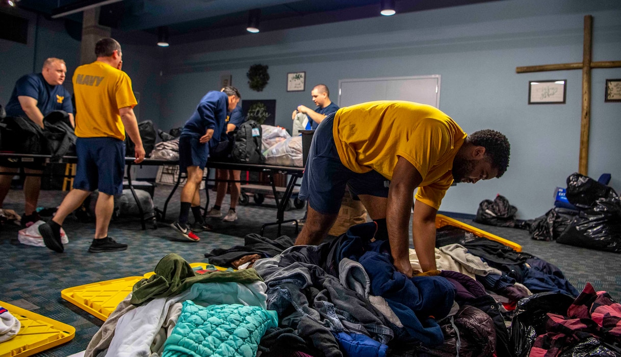 Sailors assigned Carrier Strike Group 3 sort care package supplies at Union Gospel Mission during Portland Fleet Week on June 9, 2023. Portland Fleet Week is a time-honored celebration of the sea services and provides an opportunity for the citizens of Oregon to meet Sailors, Marines and Coast Guardsmen, as well as witness firsthand the latest capabilities of today’s maritime services. (U.S. Navy photo by Mass Communication Specialist 2nd Class Gwendelyn L. Ohrazda)