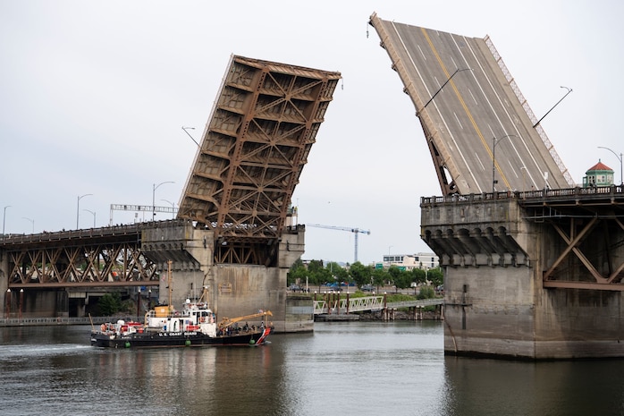 The U.S. Coast Guard Cutter Bluebell (WLI 313) passes under Burnside Bridge for the annual Rose Festival during Portland Fleet Week in Portland, Oregon, June 8, 2023. Portland Fleet Week is a time-honored celebration of the sea services and provides an opportunity for the citizens of Oregon to meet Sailors, Marines and Coast Guardsmen, as well as witness firsthand the latest capabilities of today’s maritime services. (U.S. Navy photo by Mass Communication Specialist Seaman Sophia H. Bumps)